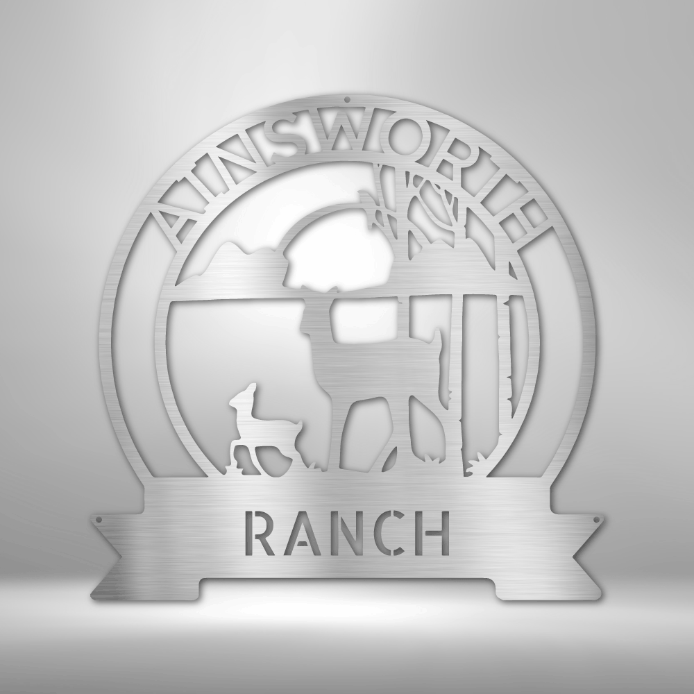 Circular logo or emblem for ’Ainsworth Ranch’ featuring a stylized landscape with a deer silhouette.