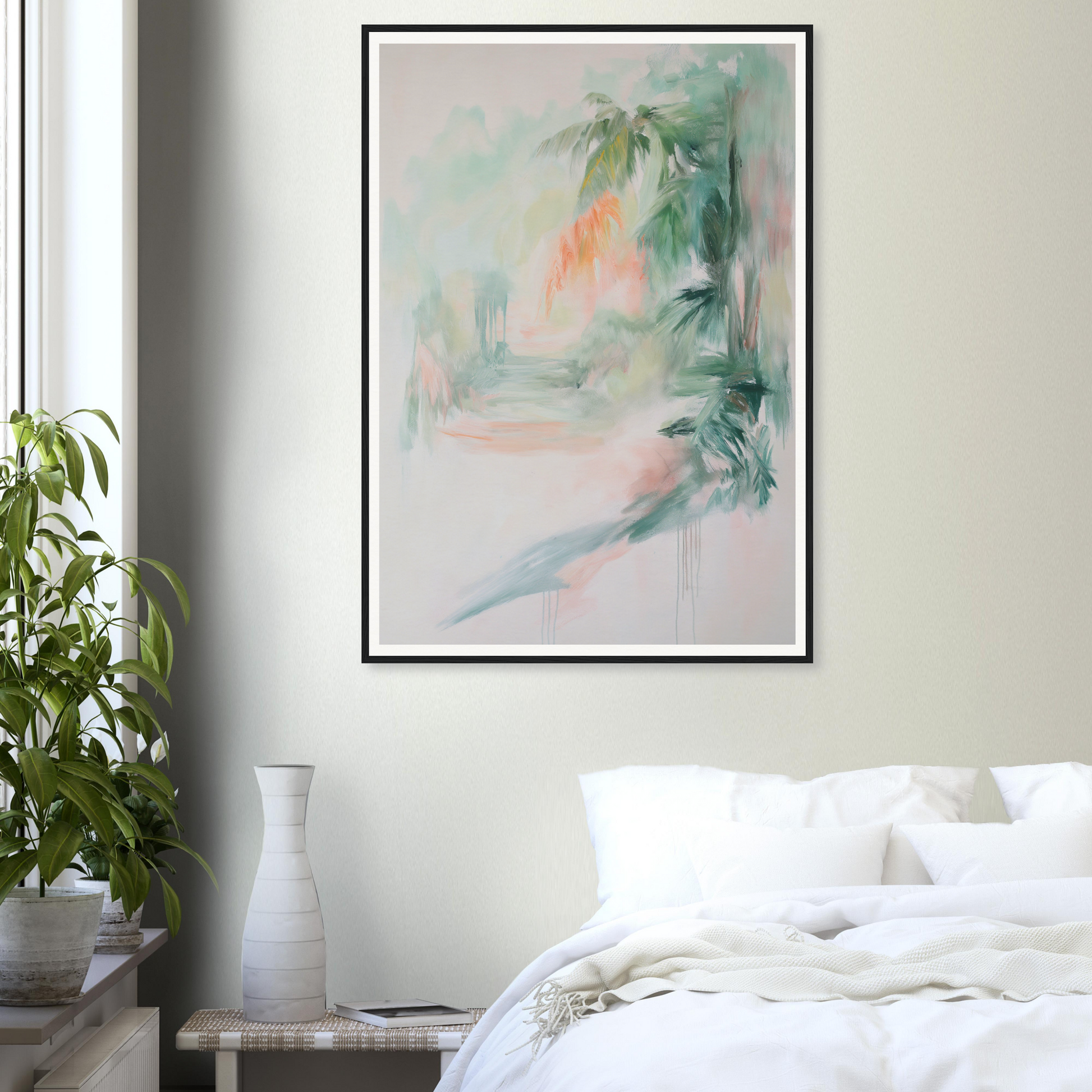 Framed wall art above bed with white bedding; a touch of room decor with a potted plant nearby.
