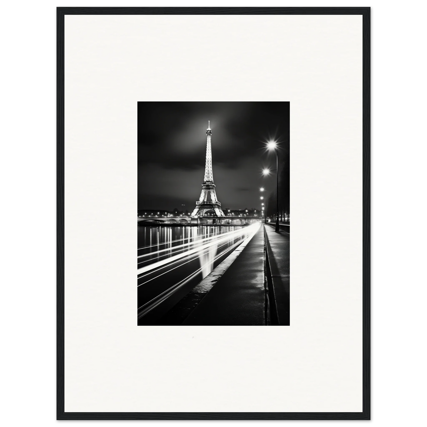 Black and white photo of the Eiffel Tower glowing at night, perfect for premium framed wall art
