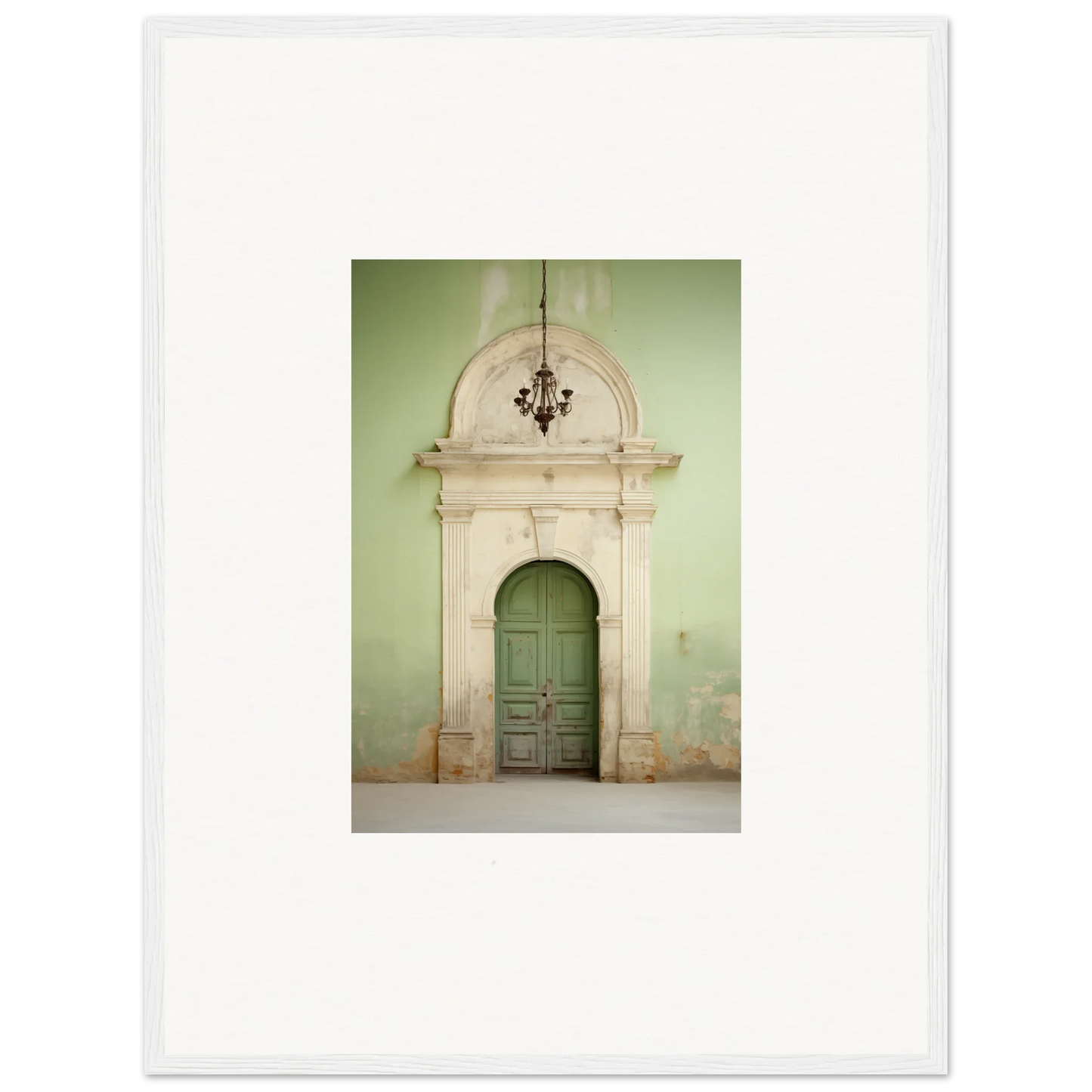 Ornate green wooden door in stone arch with crown molding from Thresholds Quiet Whisper