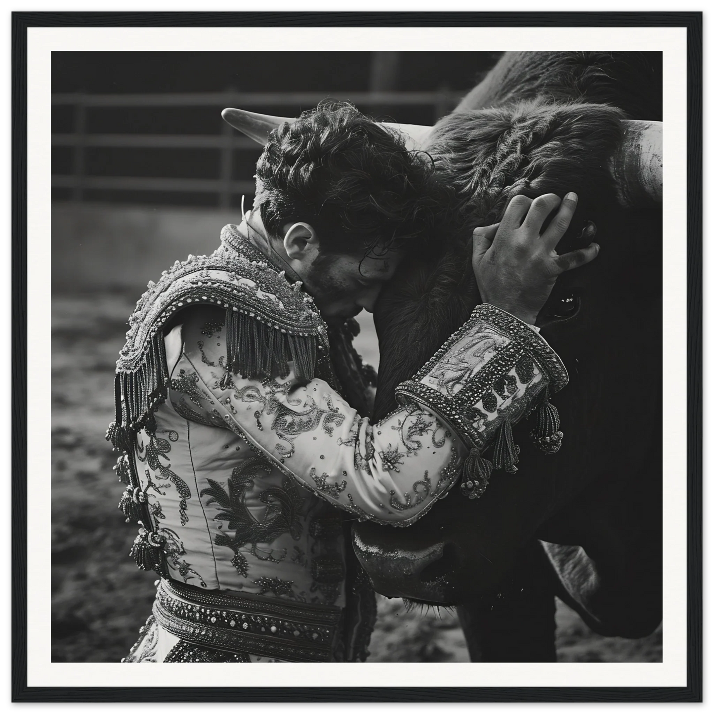 Matador in embroidered jacket embracing bull in Bullring Reverie Communion framed poster