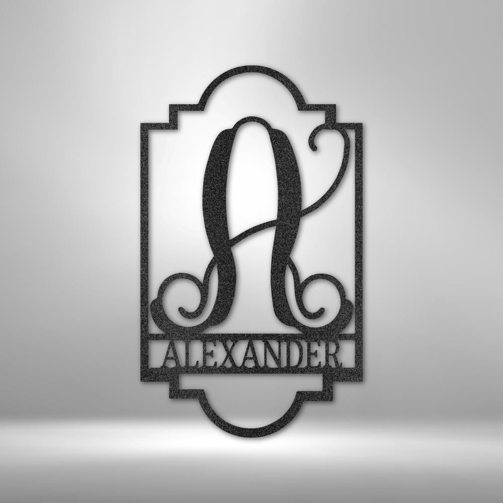 Decorative monogram sign featuring the letter ’A’ and the name ’ALEXANDER’ in an ornate frame design.