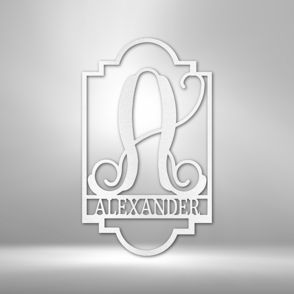 Ornate monogram design featuring the letter ’A’ and the name ’ALEXANDER’ in a decorative frame.