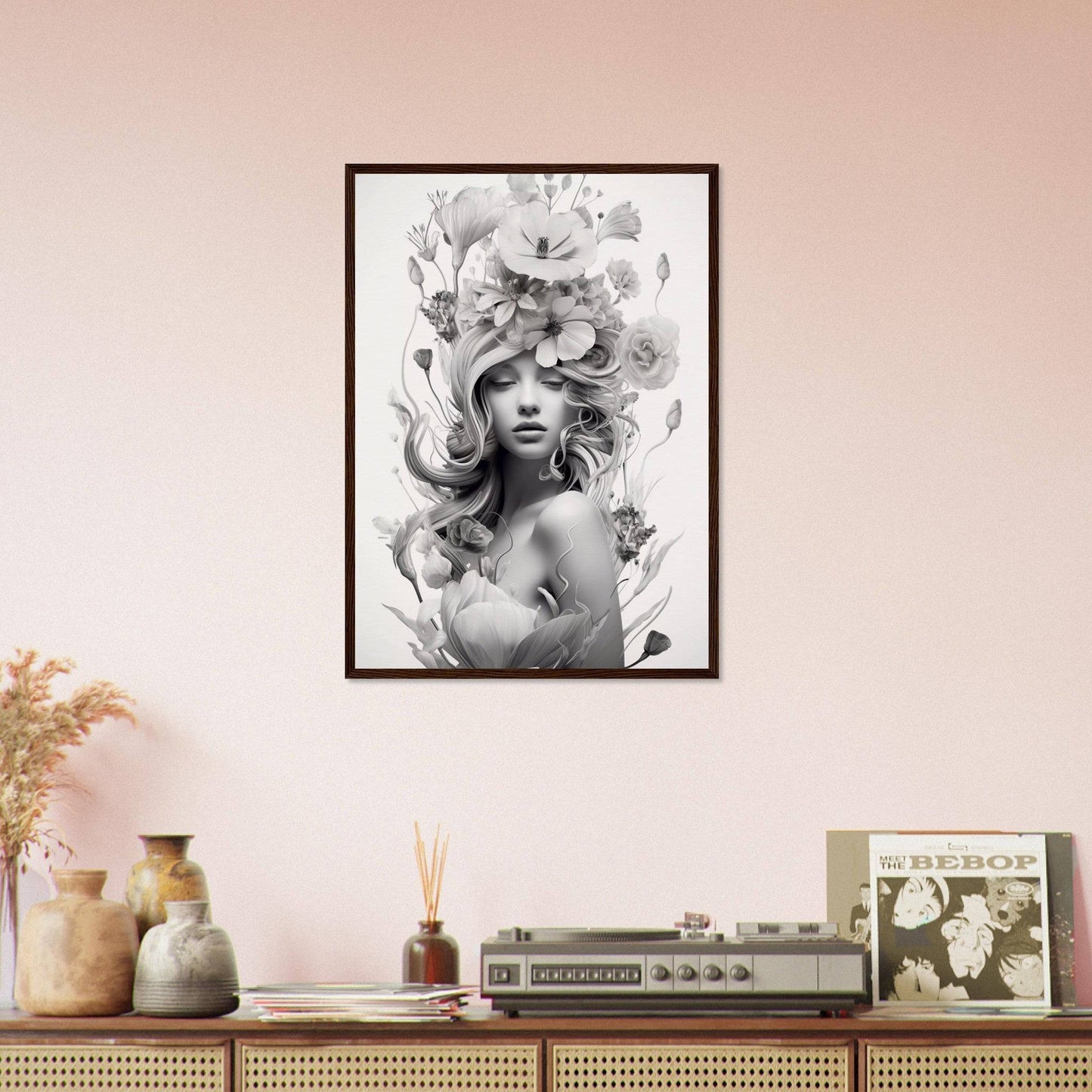 Framed black and white portrait of a woman with an elaborate floral headdress.