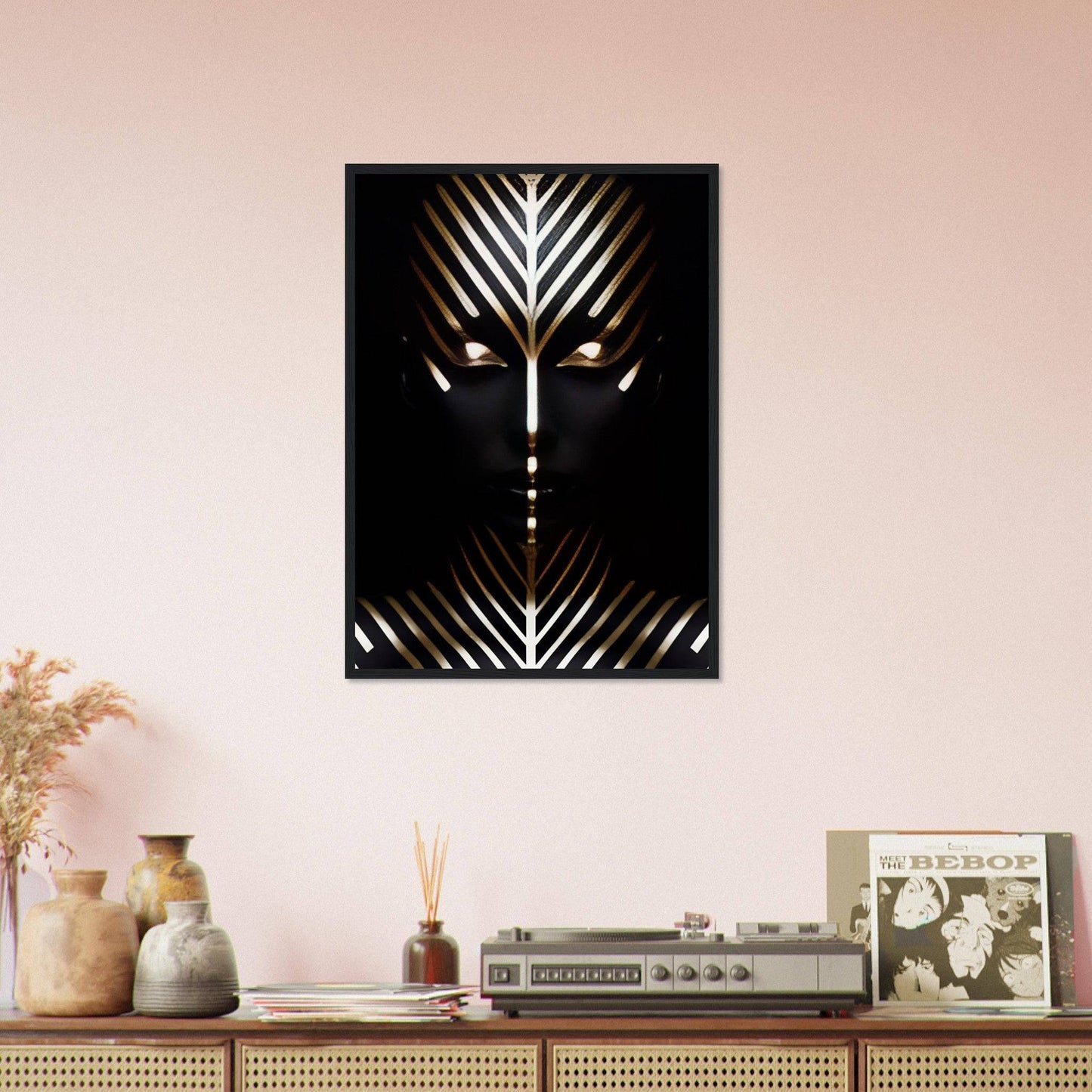 Abstract geometric artwork featuring a stylized face-like design with radiating lines on a dark background.