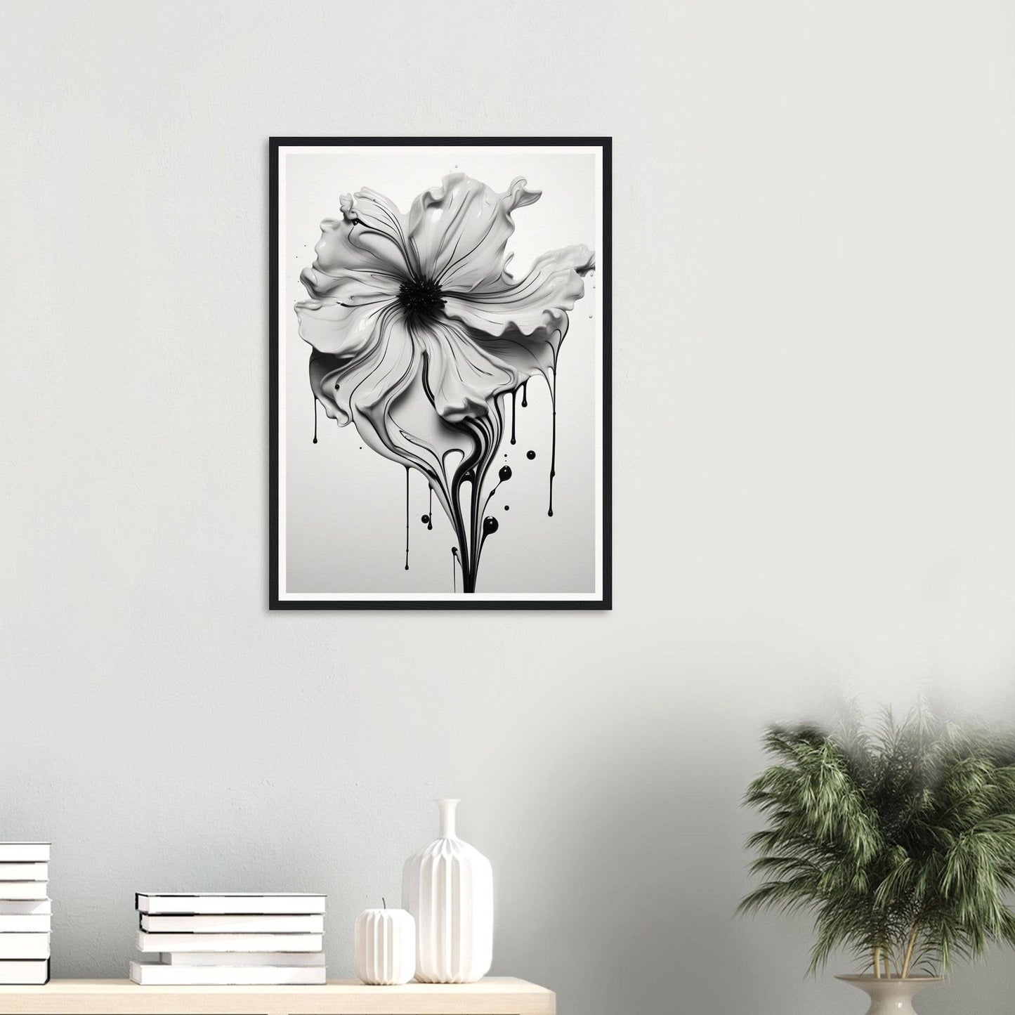 A black and white flower with dripping paint on it