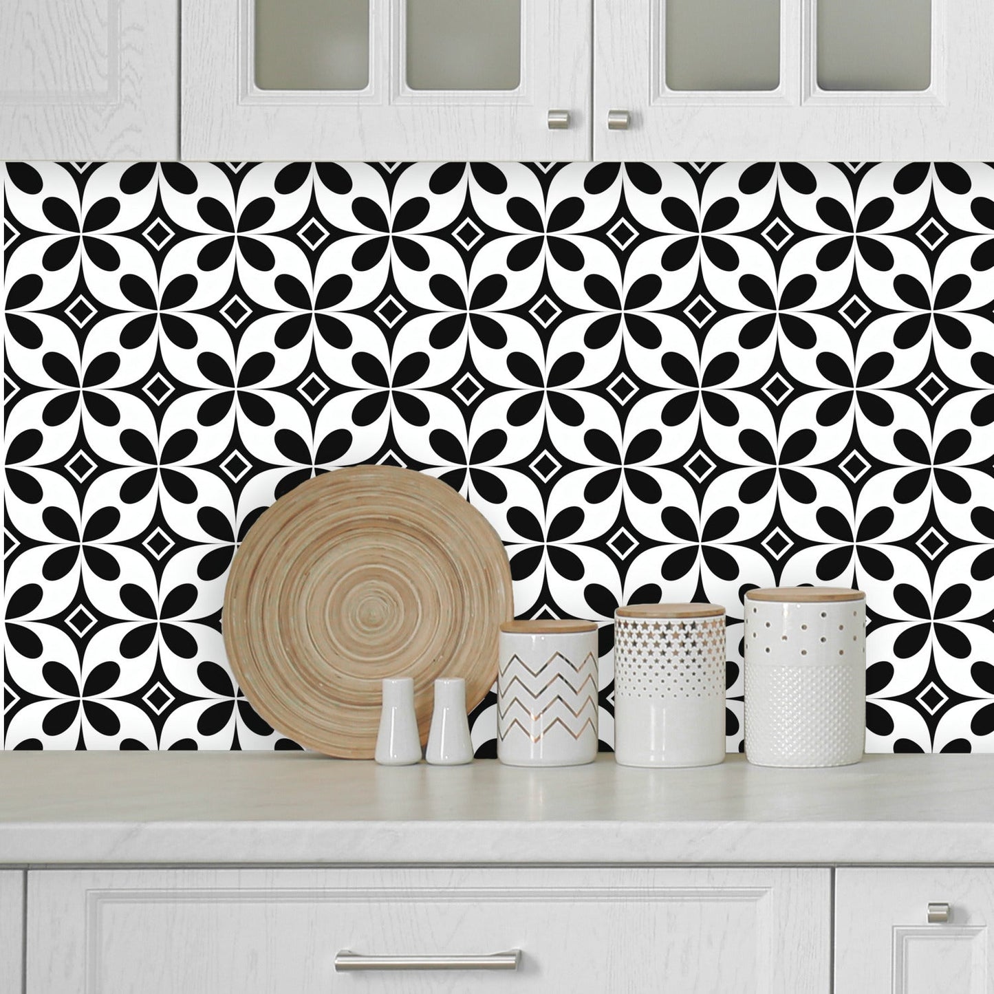 A black and white tile pattern with a circular design