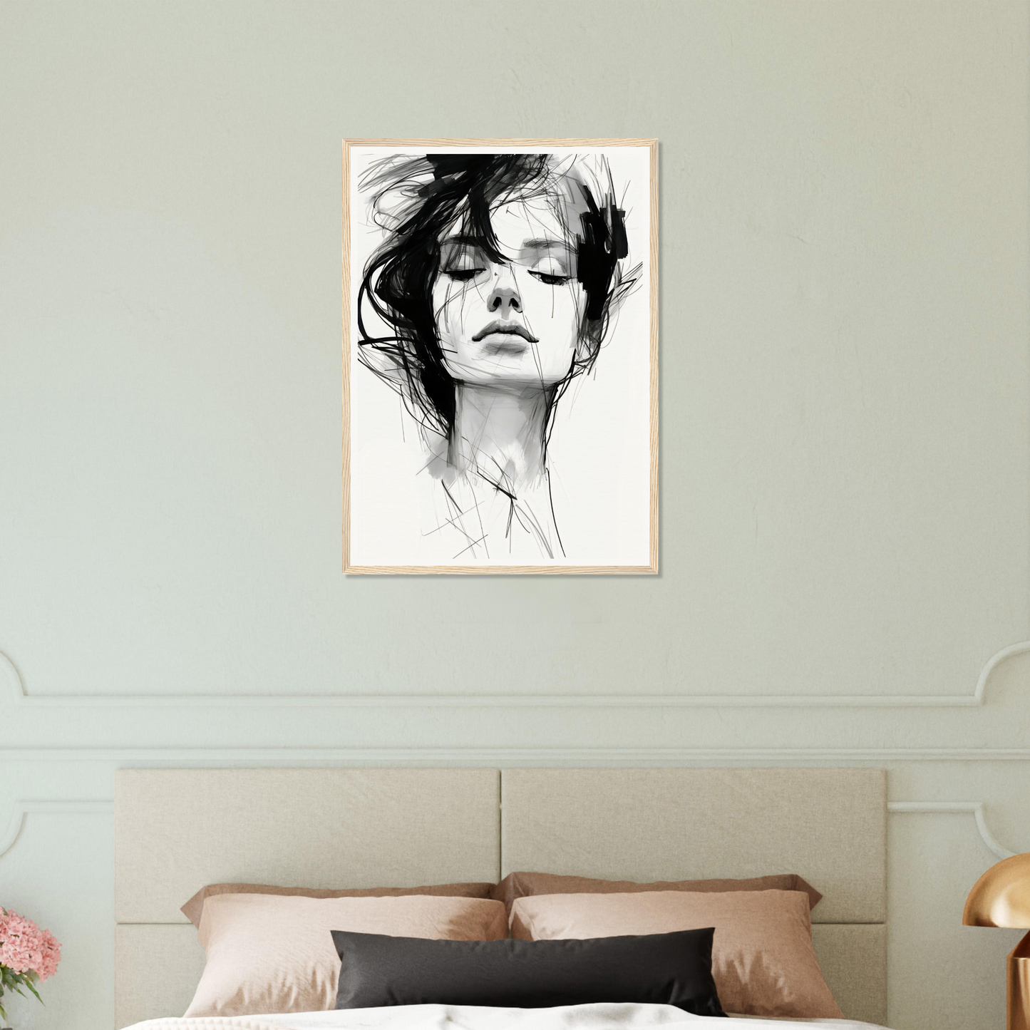 A black and white drawing of a woman’s face on a wall
