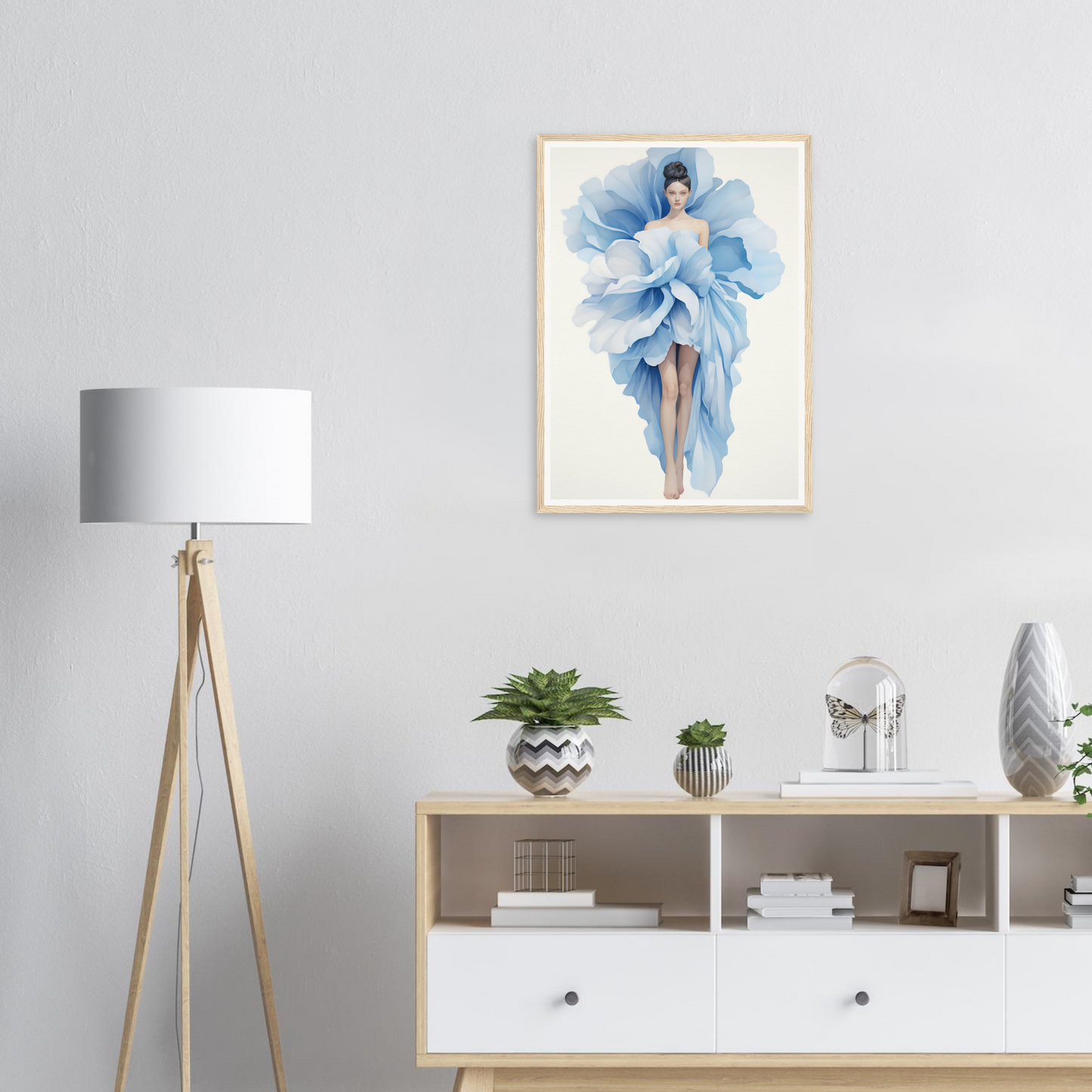 A blue flower in a white frame on a wall