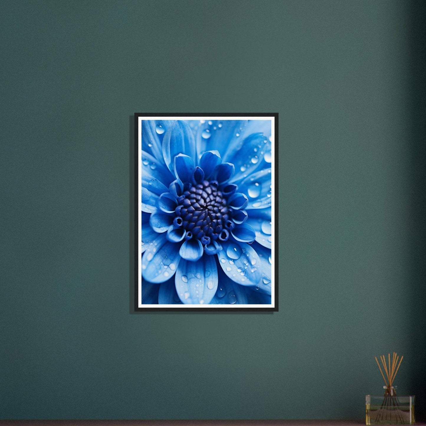 Vibrant blue flower with water droplets on its petals in a framed photograph.