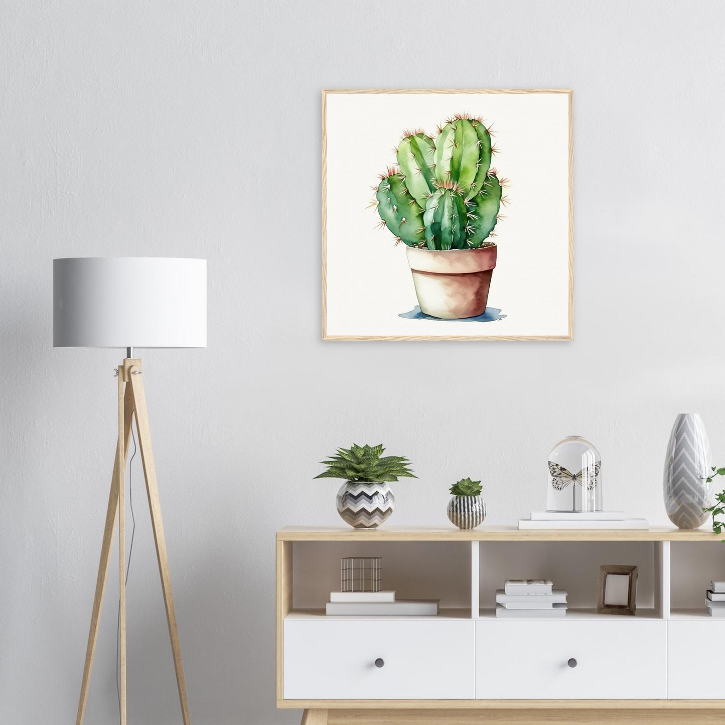 A cactus plant in a pot on a wall