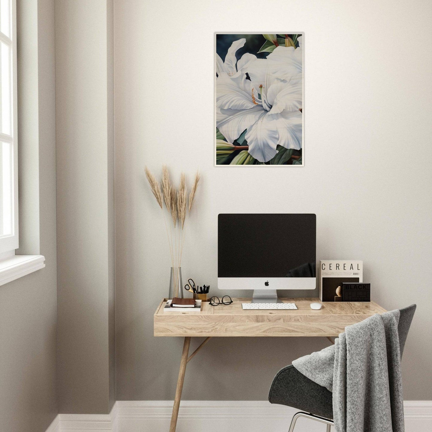 Minimalist wooden desk with a computer monitor and office accessories.