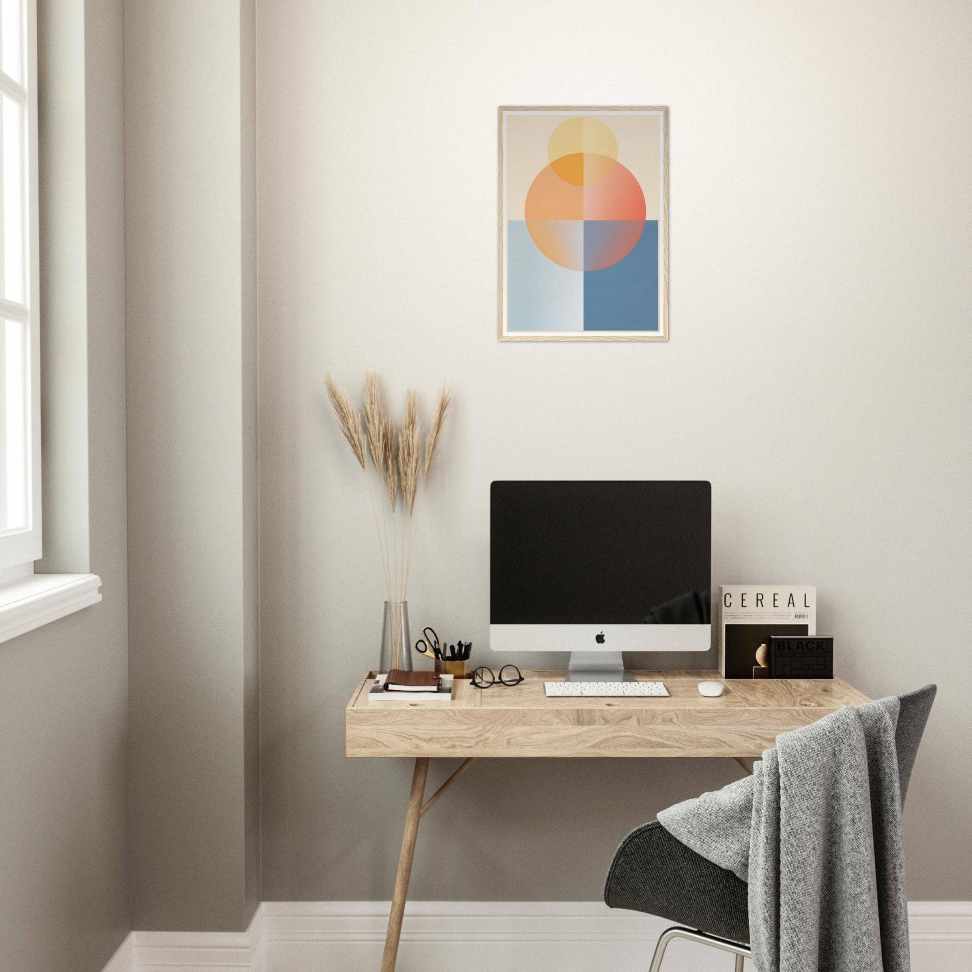 Minimalist wooden desk with a computer monitor and office accessories.