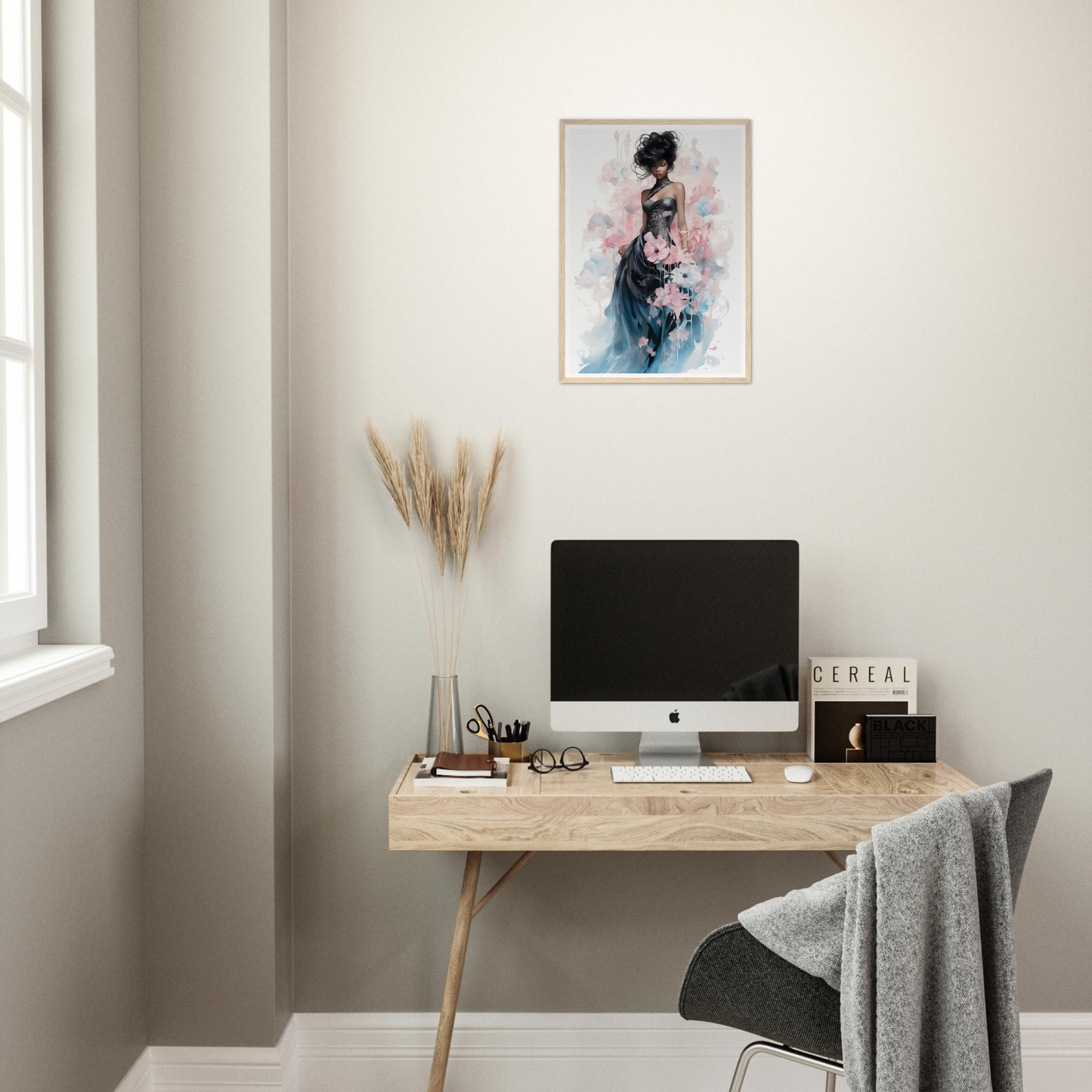 Minimalist wooden desk with a computer monitor and office accessories.