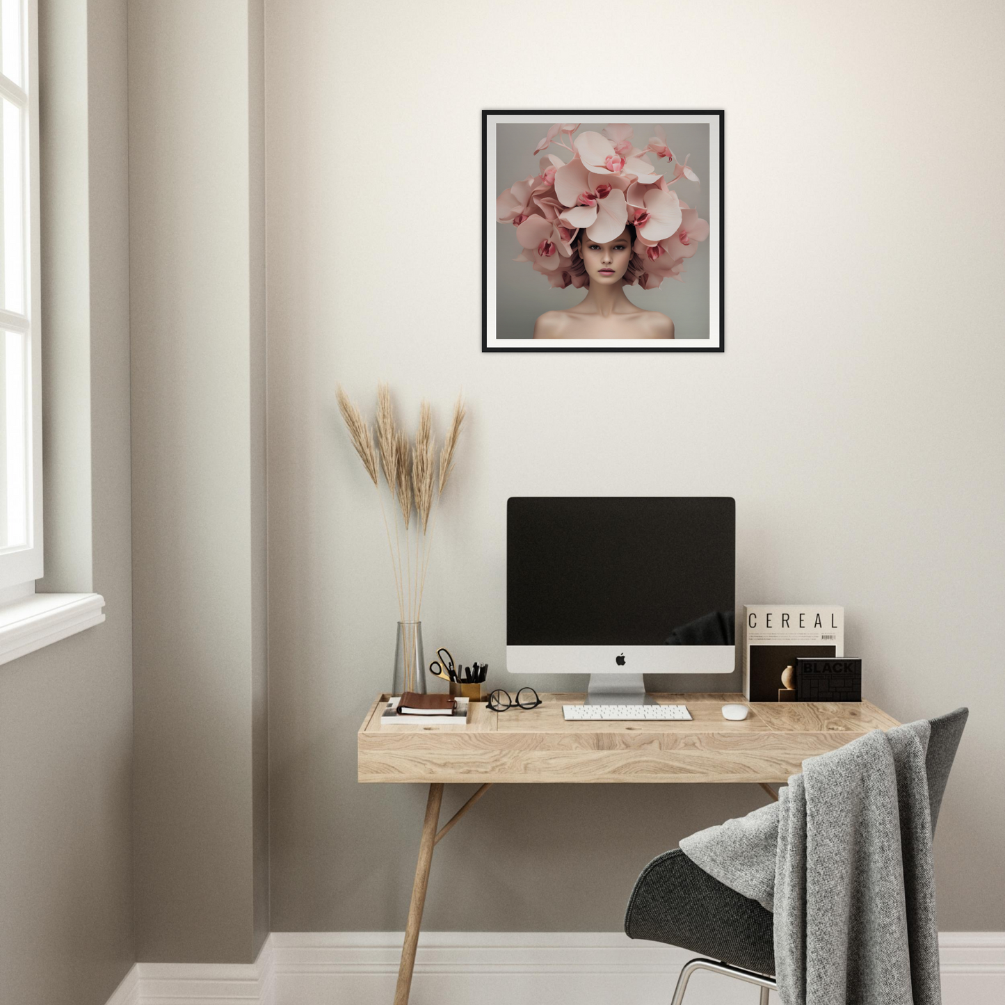 Minimalist wooden desk with a computer monitor and office accessories.