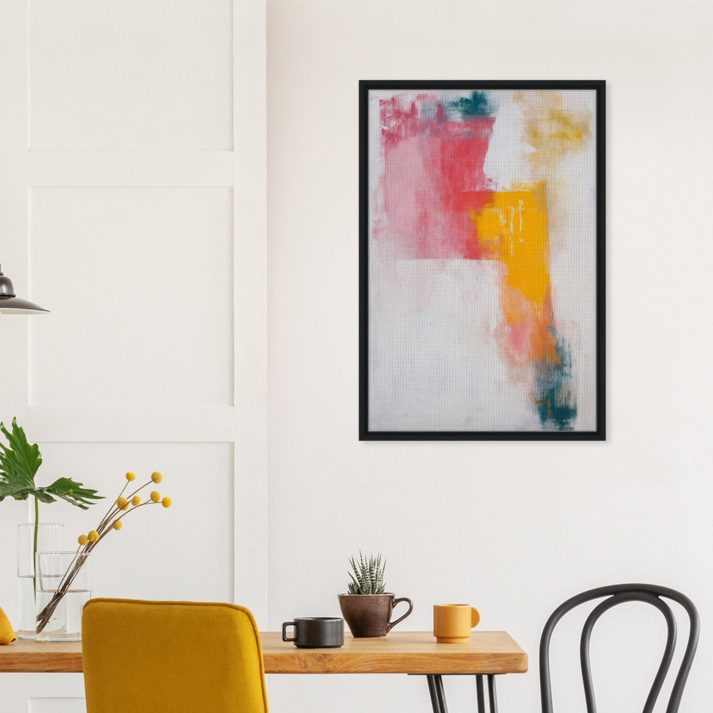 Abstract painting with vibrant pink, yellow, and blue brushstrokes in a framed canvas print