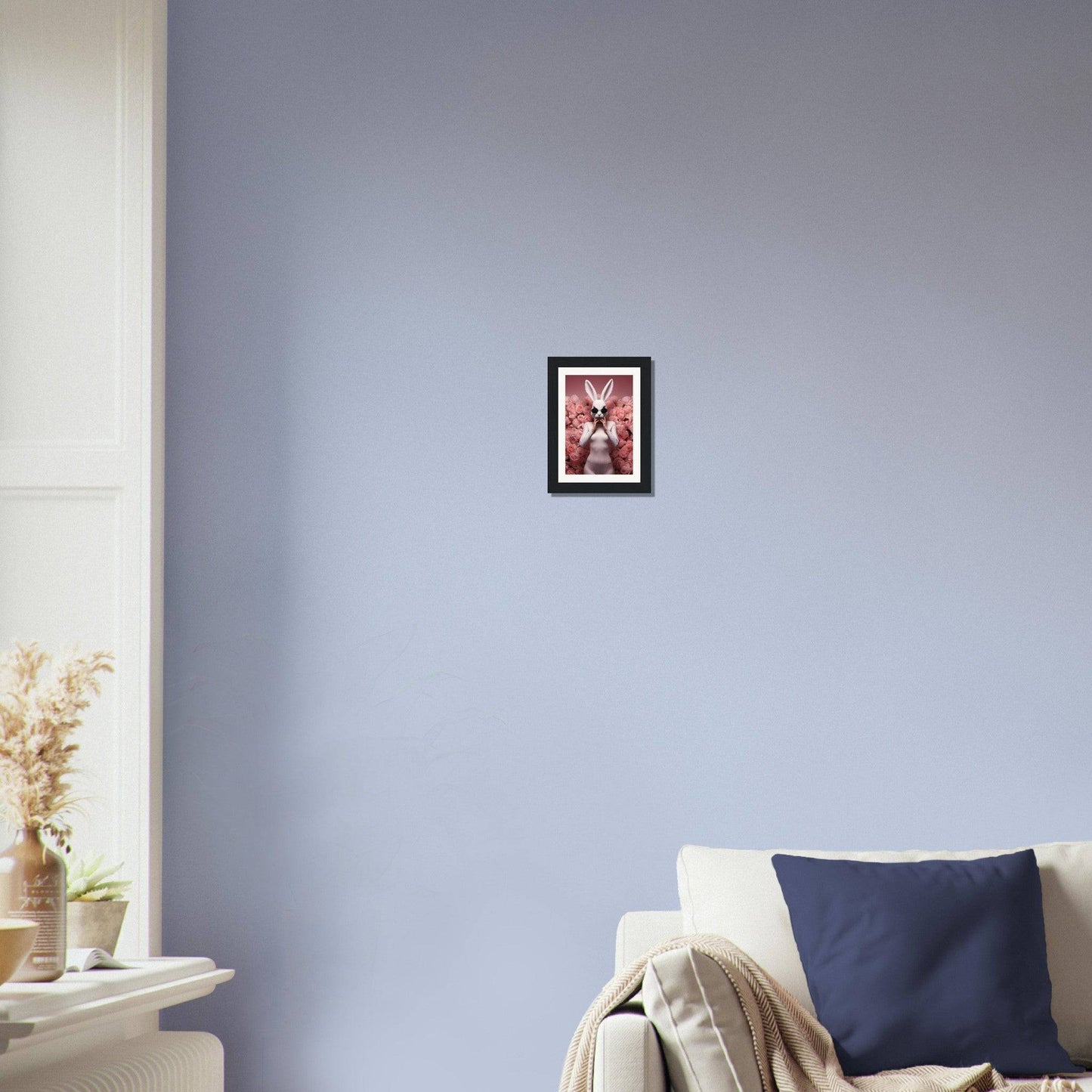 Framed artwork depicting a red figure with outstretched arms against a dark background.