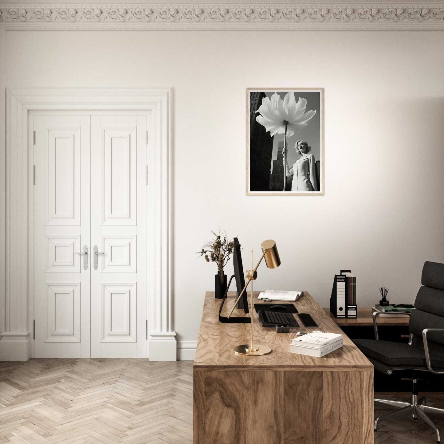 A desk with a chair and a picture on the wall