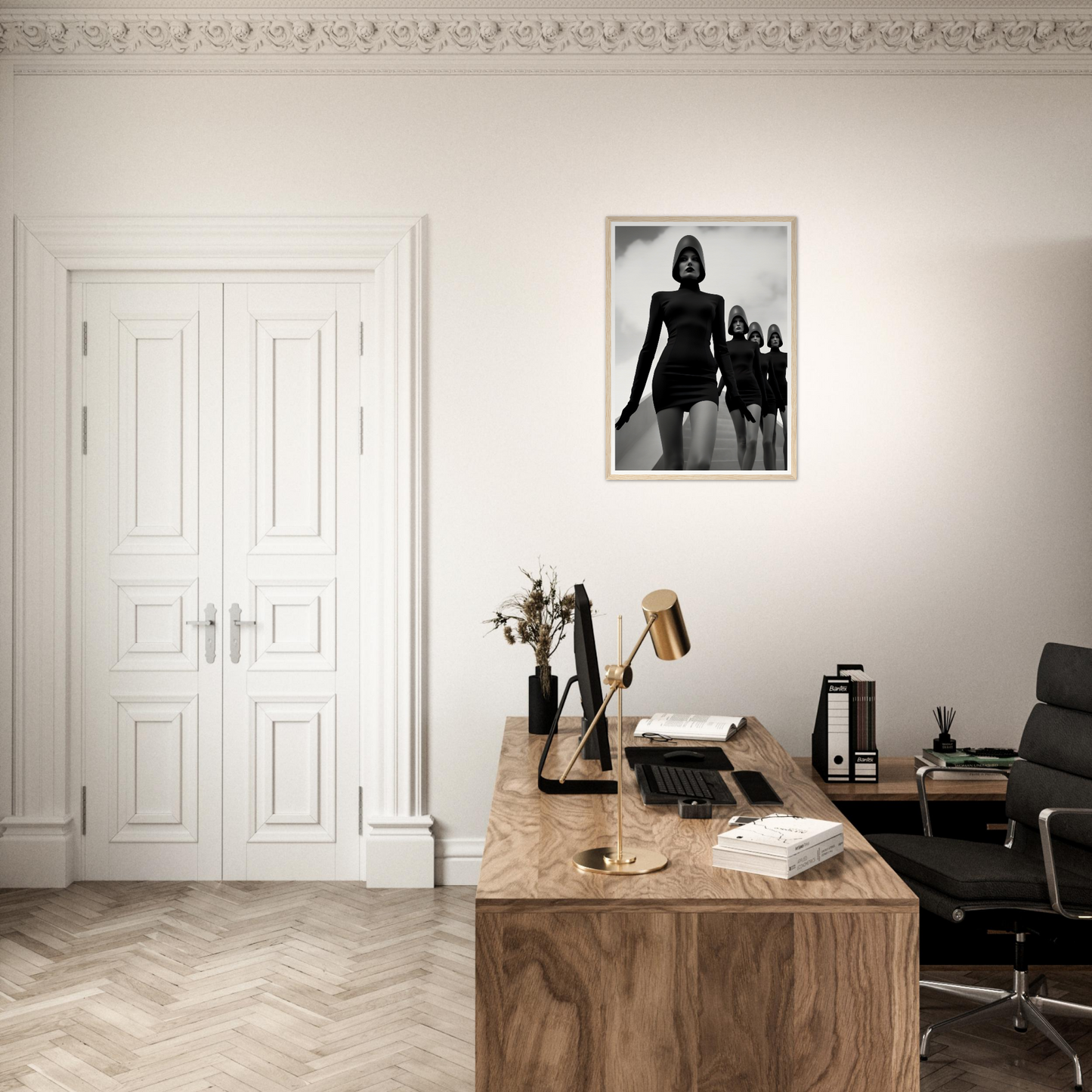 A desk with a chair and a picture on the wall