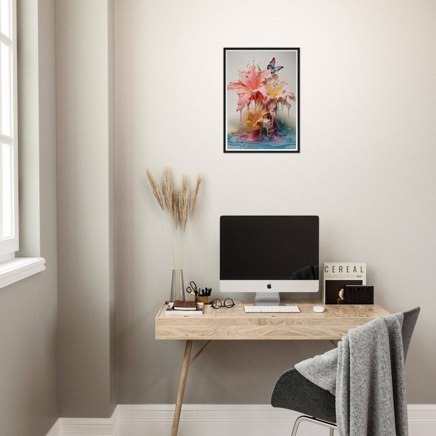 A desk with a computer and a plant on it