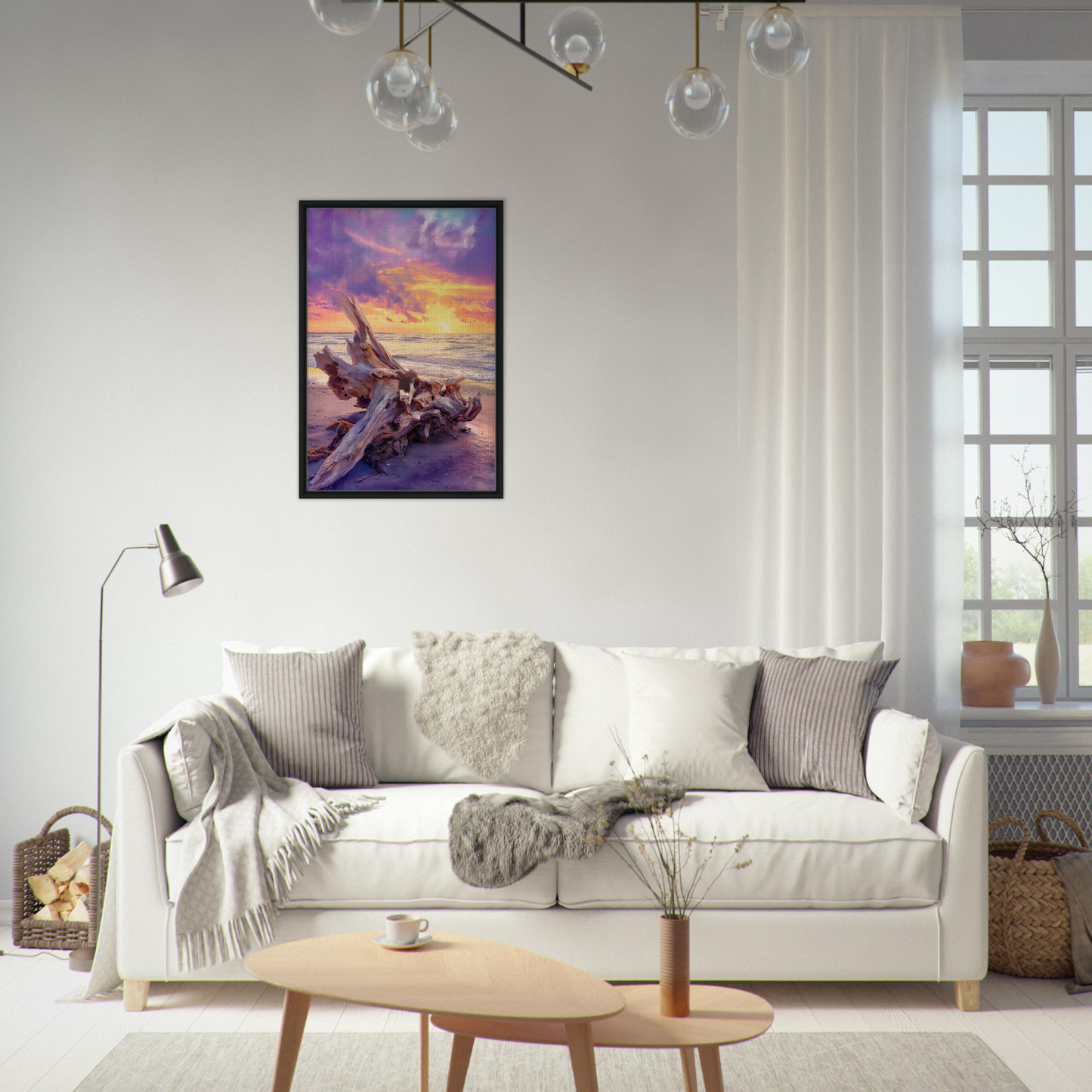 White sofa adorned with throw pillows and blankets from Driftwood’s Sunset Reverie