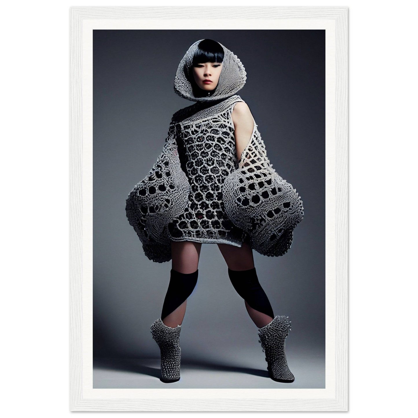 Avant-garde dress with a honeycomb-like pattern and exaggerated silhouette.