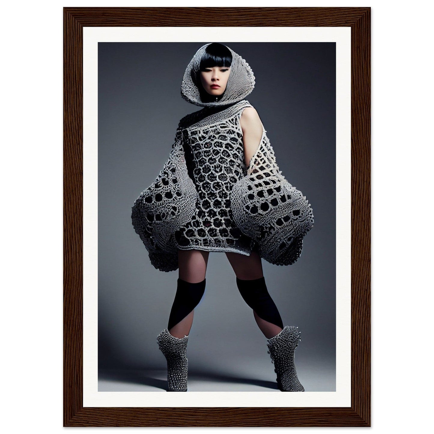 Avant-garde fashion garment with a honeycomb-like pattern and exaggerated sculptural shapes.