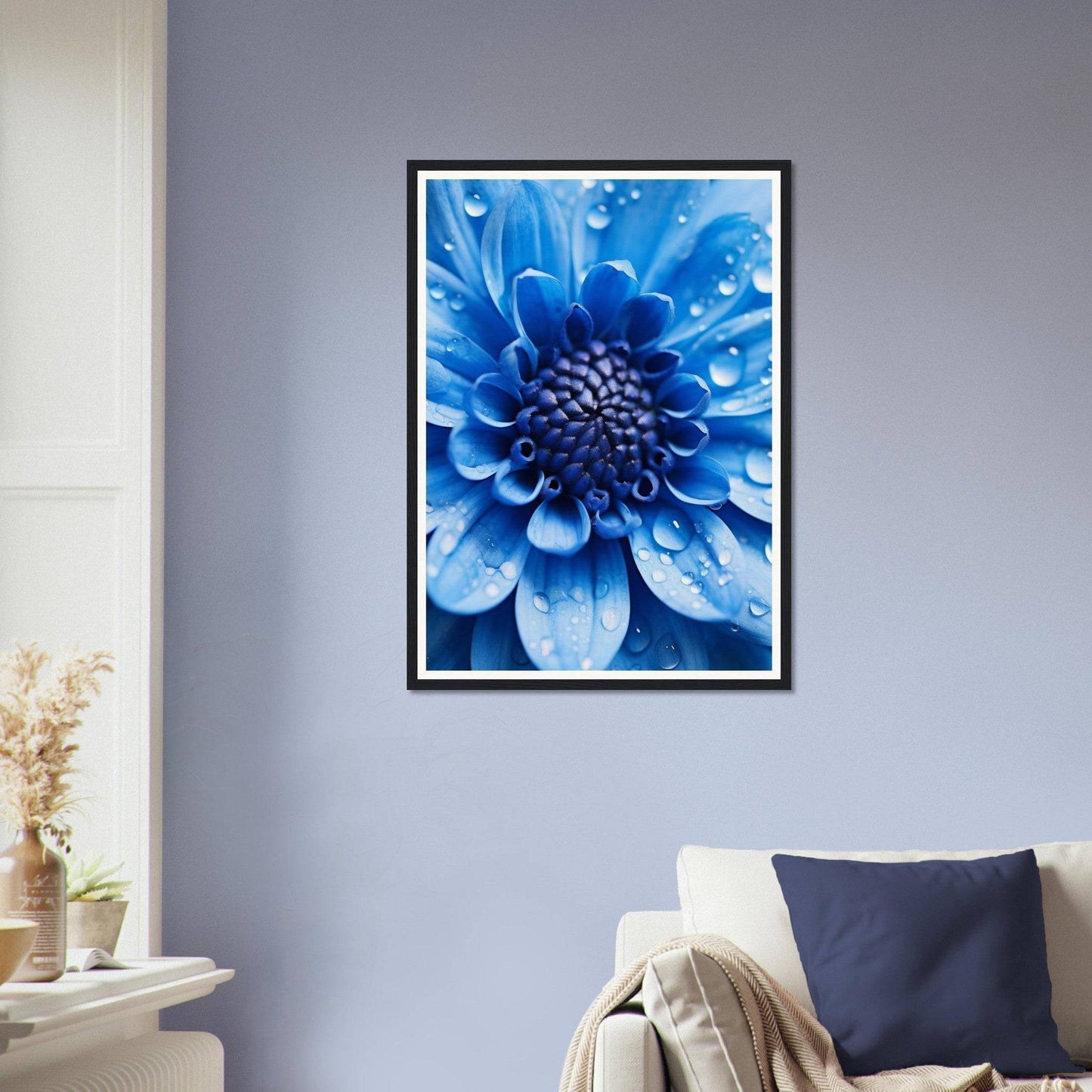 Framed photograph of a vibrant blue flower with water droplets on its petals.