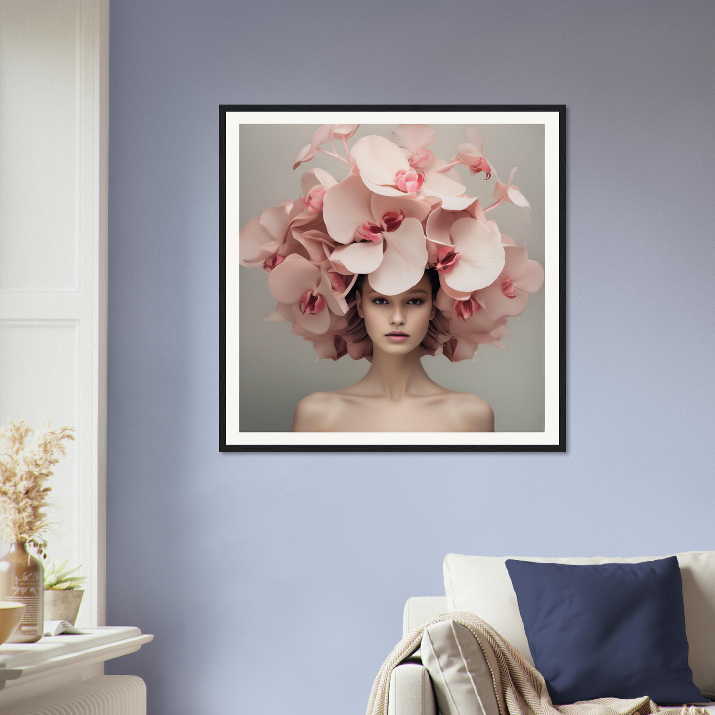 Framed portrait of a person wearing an elaborate floral headdress made of pink orchids.