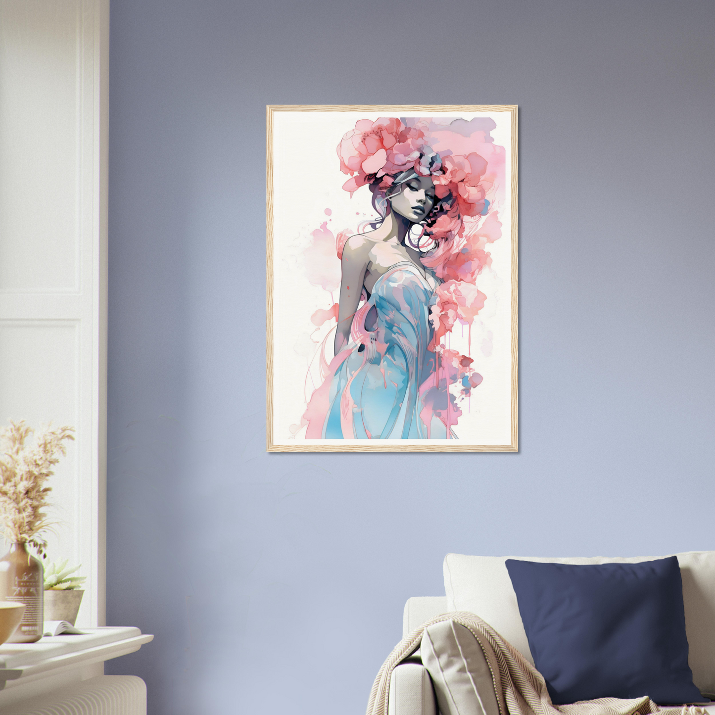 Framed artwork depicting a woman with pink floral elements and a blue dress in a watercolor style.