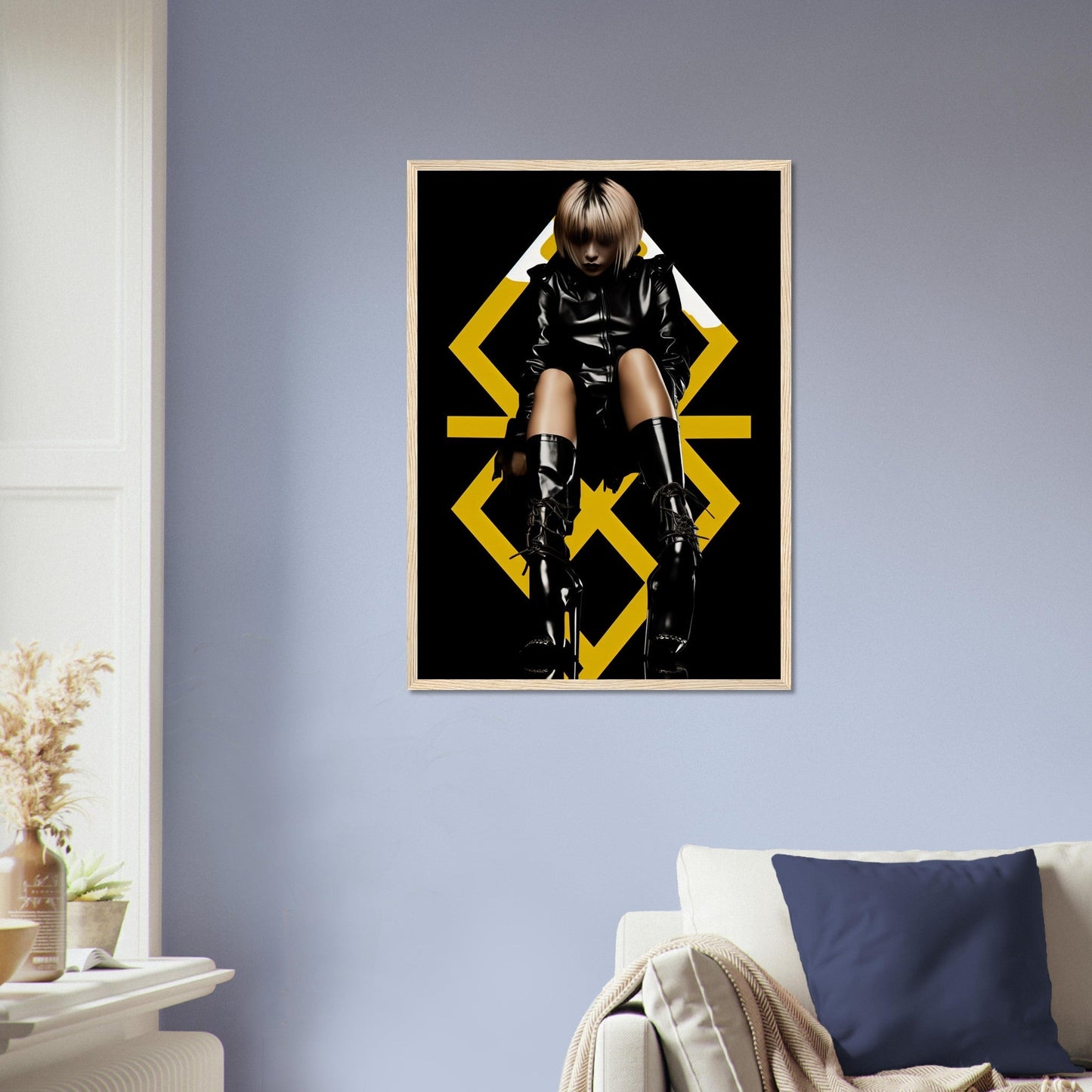 Framed poster featuring a person in black clothing and boots posing against a geometric yellow design.