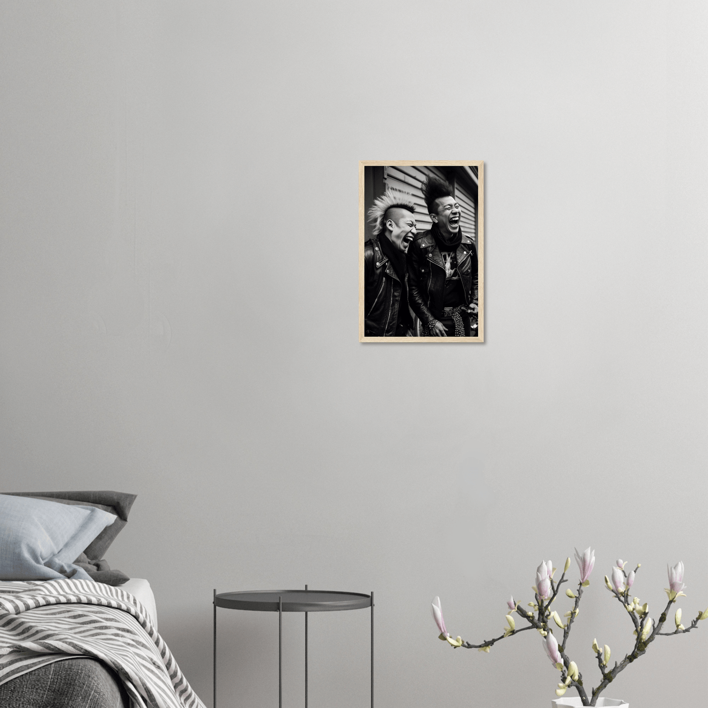 Framed black and white photograph of two people hanging on a wall.