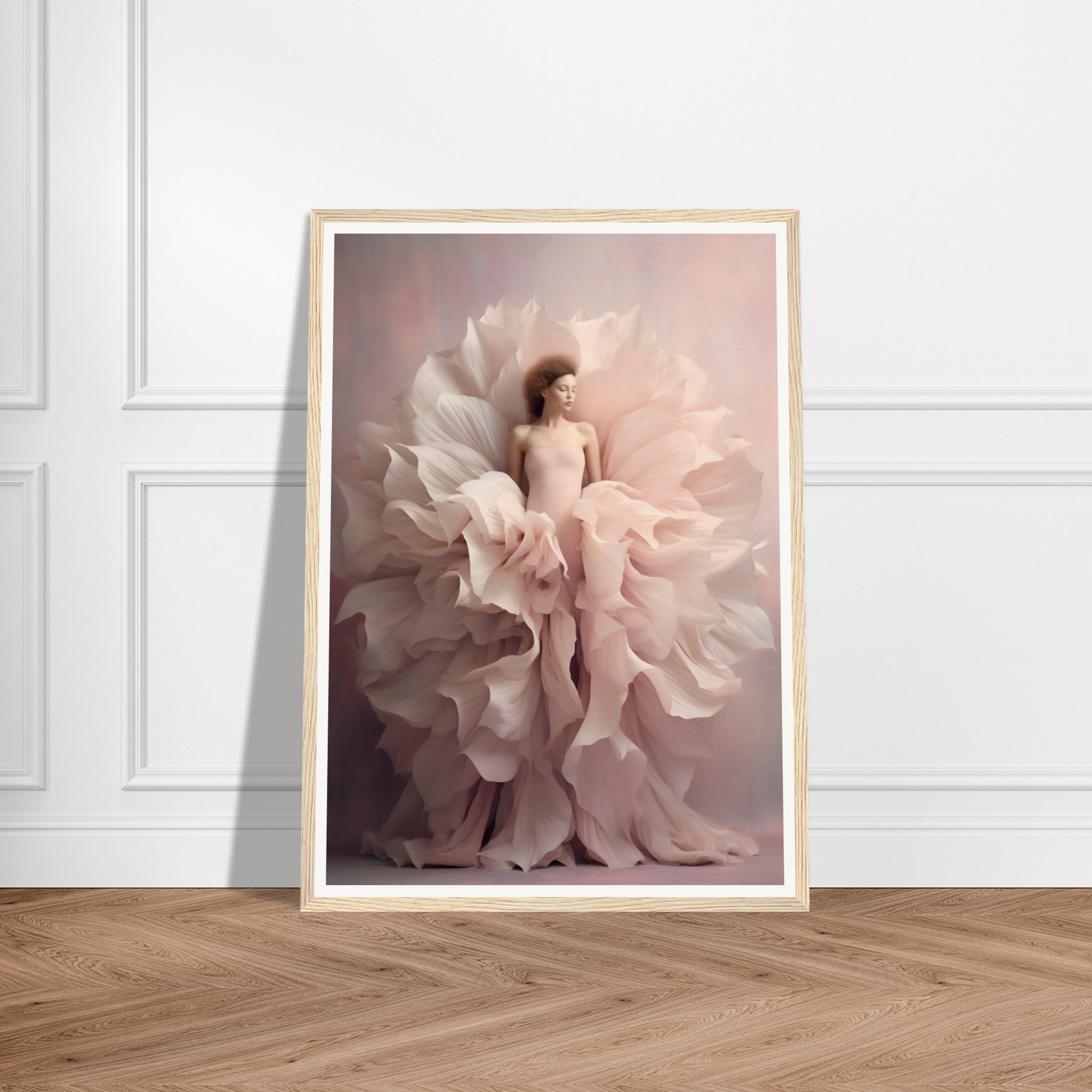 Framed photograph of a person surrounded by billowing, petal-like fabric in soft pink tones.