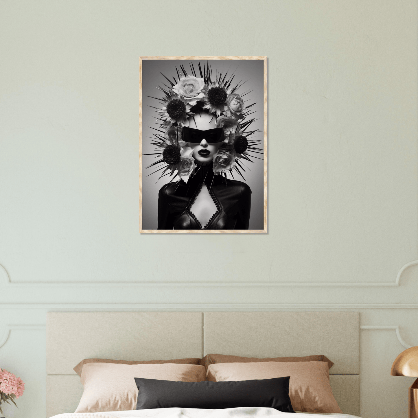 Surreal black and white portrait of a figure with spiky, flower-like protrusions emerging from their head.