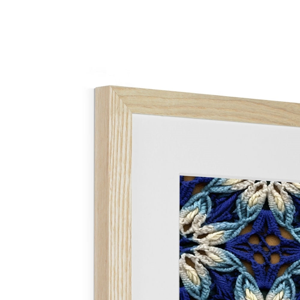 A framed picture of a blue and white flower pattern