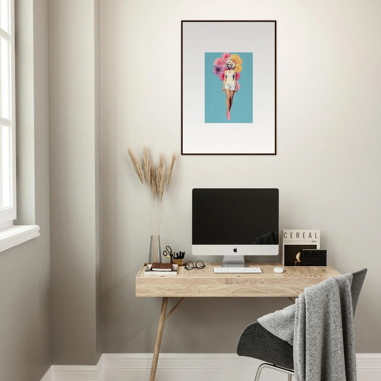 Minimalist home office with wooden desk, iMac, and framed wall art from Bubbling Radiant Essence