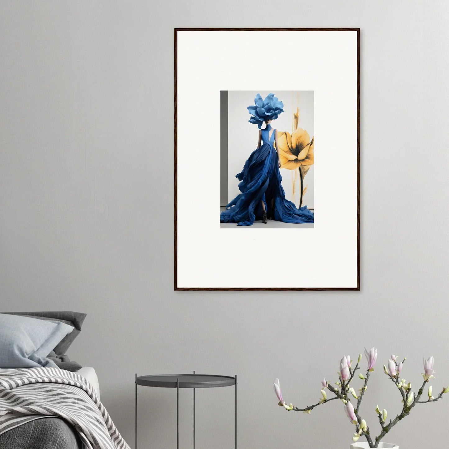 Framed wall art of a flowing blue dress and yellow flower in Cerulean Bloom Envoy