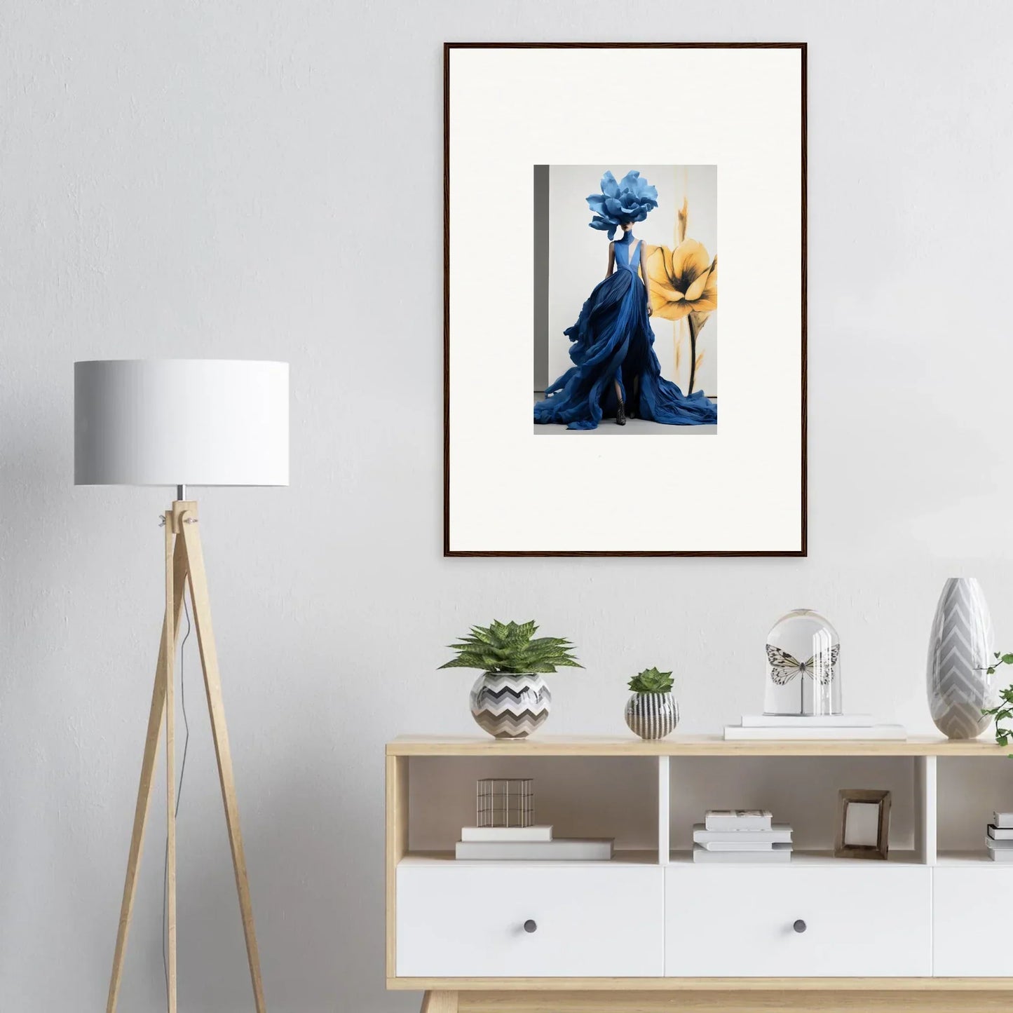 Framed wall art of Cerulean Bloom Envoy with blue floral figure and yellow flower