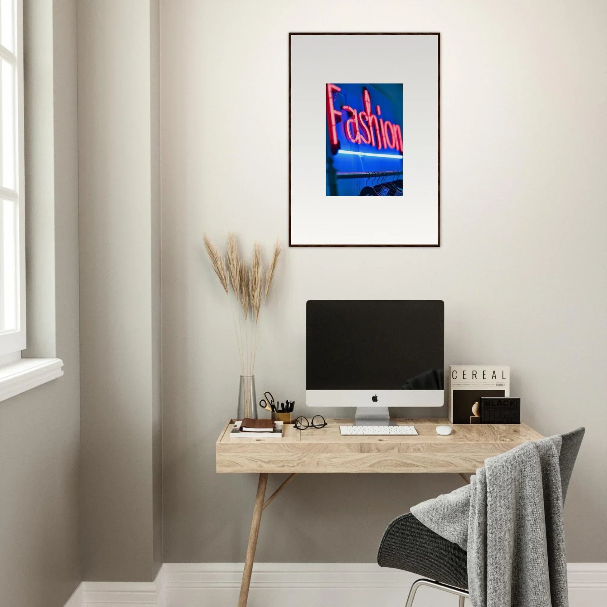 Minimalist home office with wooden desk, computer, and Velvet Signature framed wall art