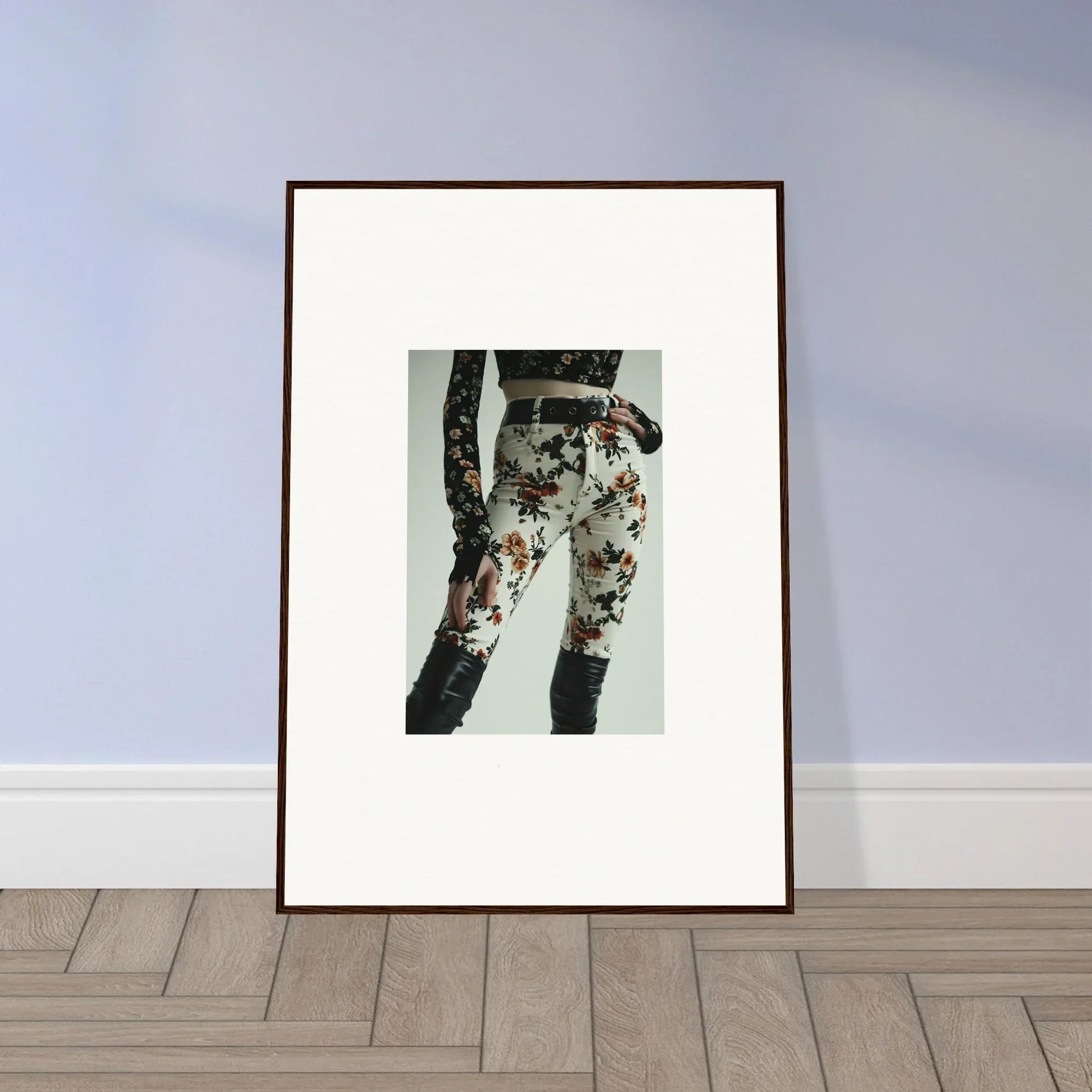 Framed artwork depicting floral-patterned pants or leggings.