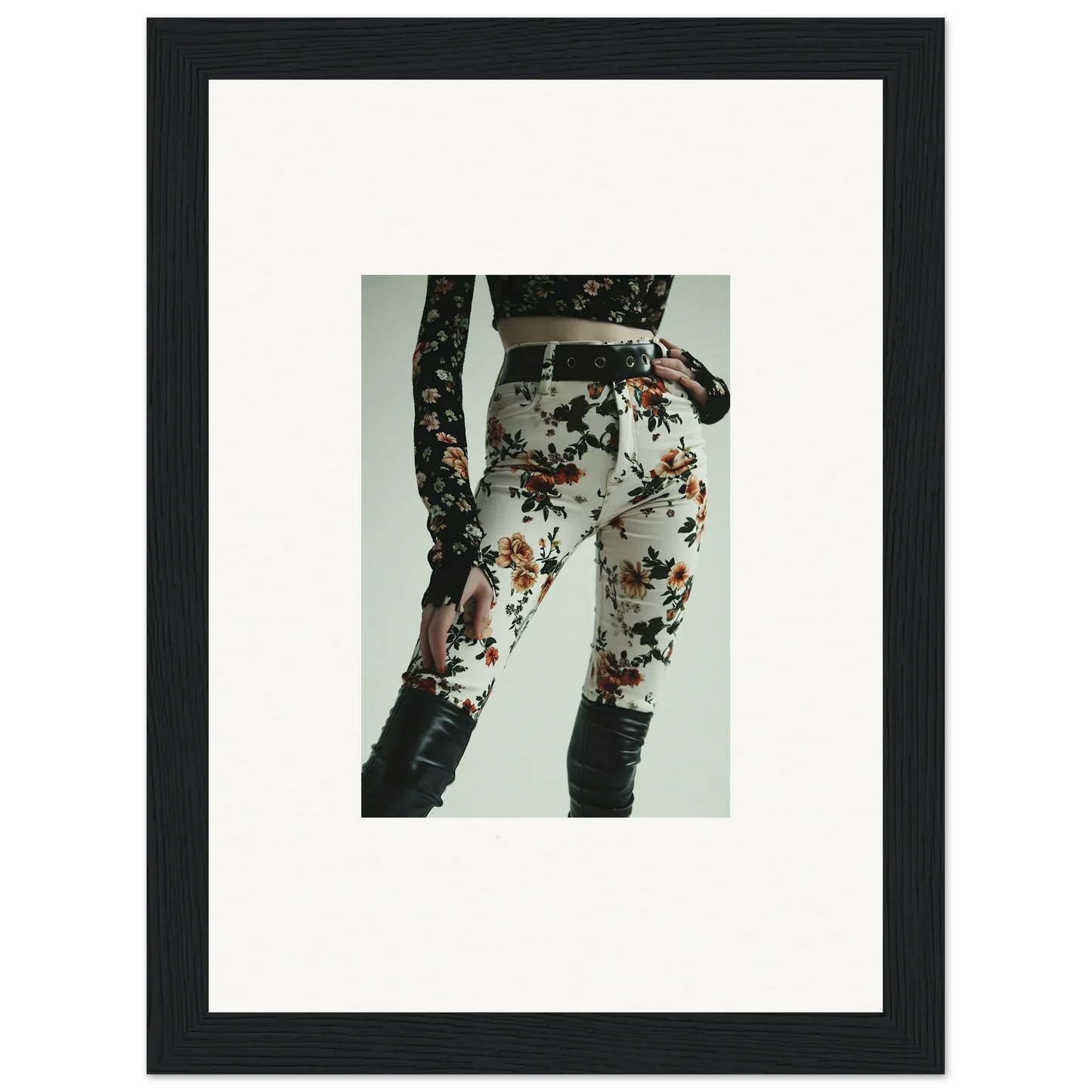 Floral-patterned pants or leggings with lace-up details on the sides.