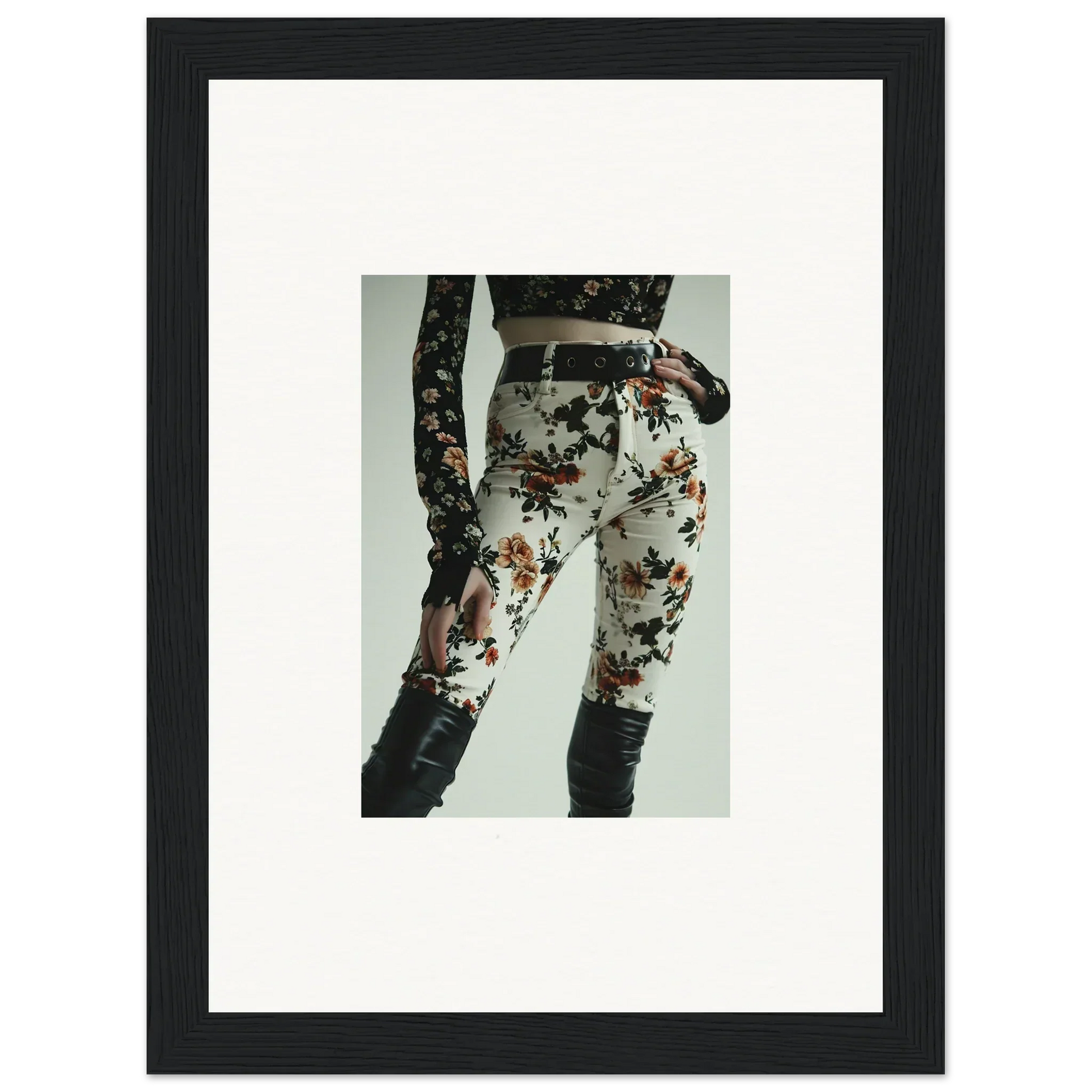 Floral-patterned pants or leggings with lace-up details on the sides.