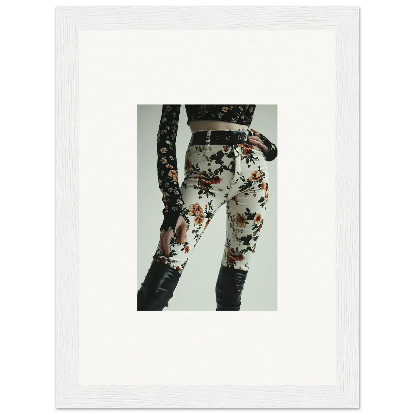Floral print pants with black lace-up detailing on the side.