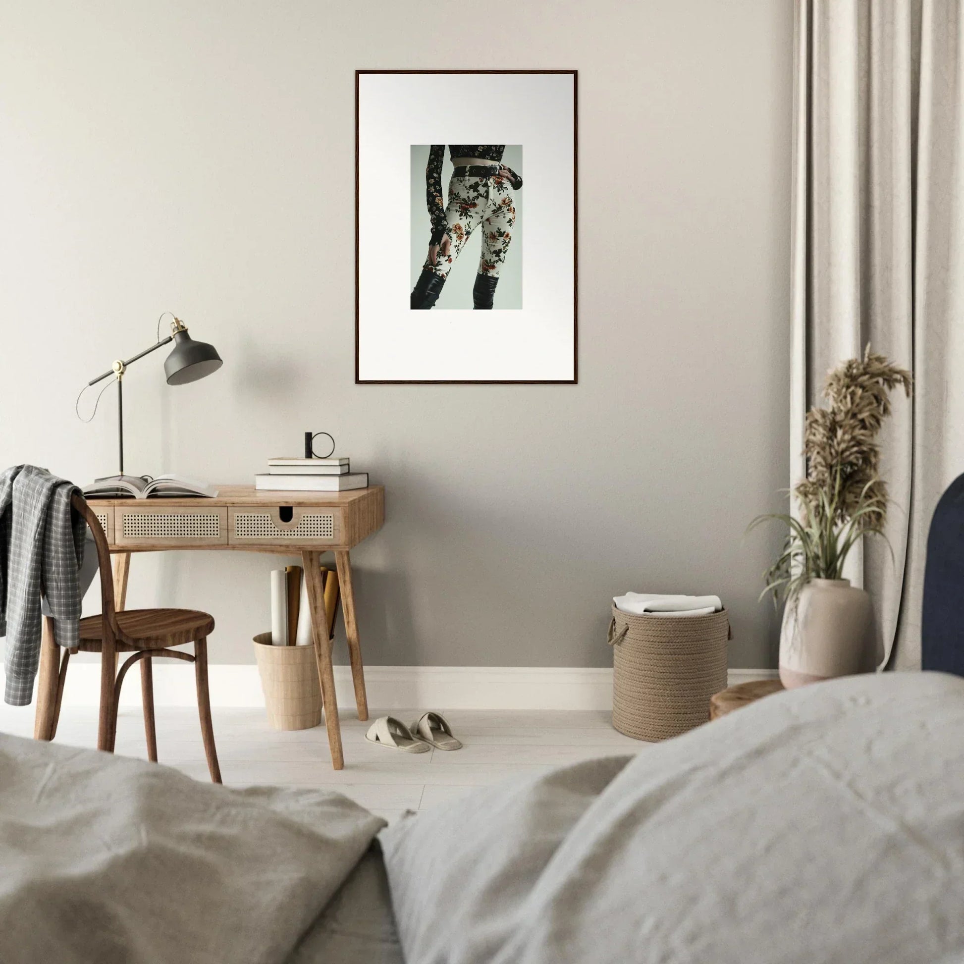 Framed black and white photograph of legs and feet hanging in the air.