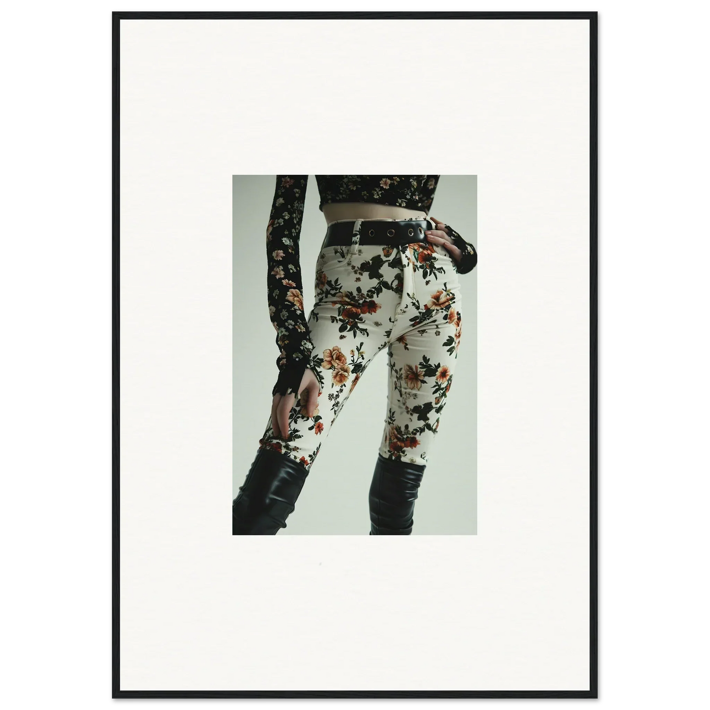Floral-patterned pants or leggings with dark knee-high boots.