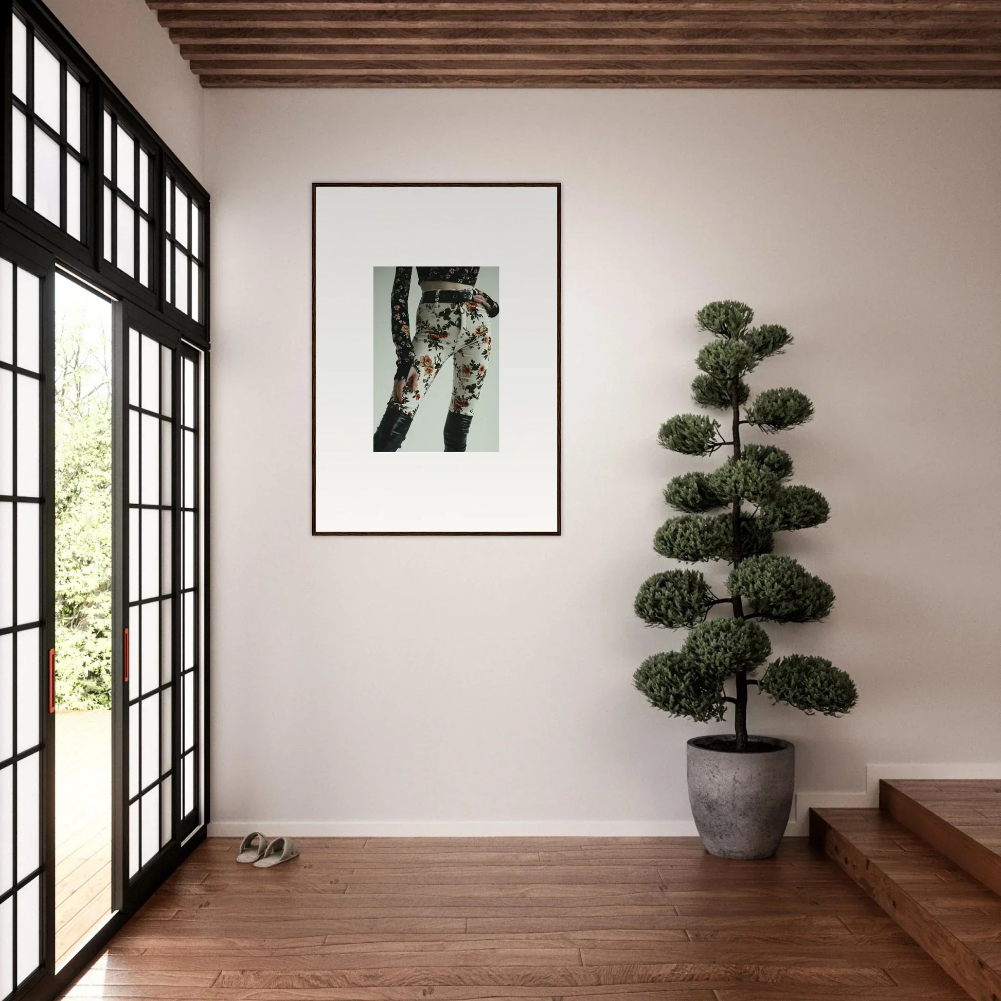Framed black and white photograph of a person’s legs wearing patterned pants.