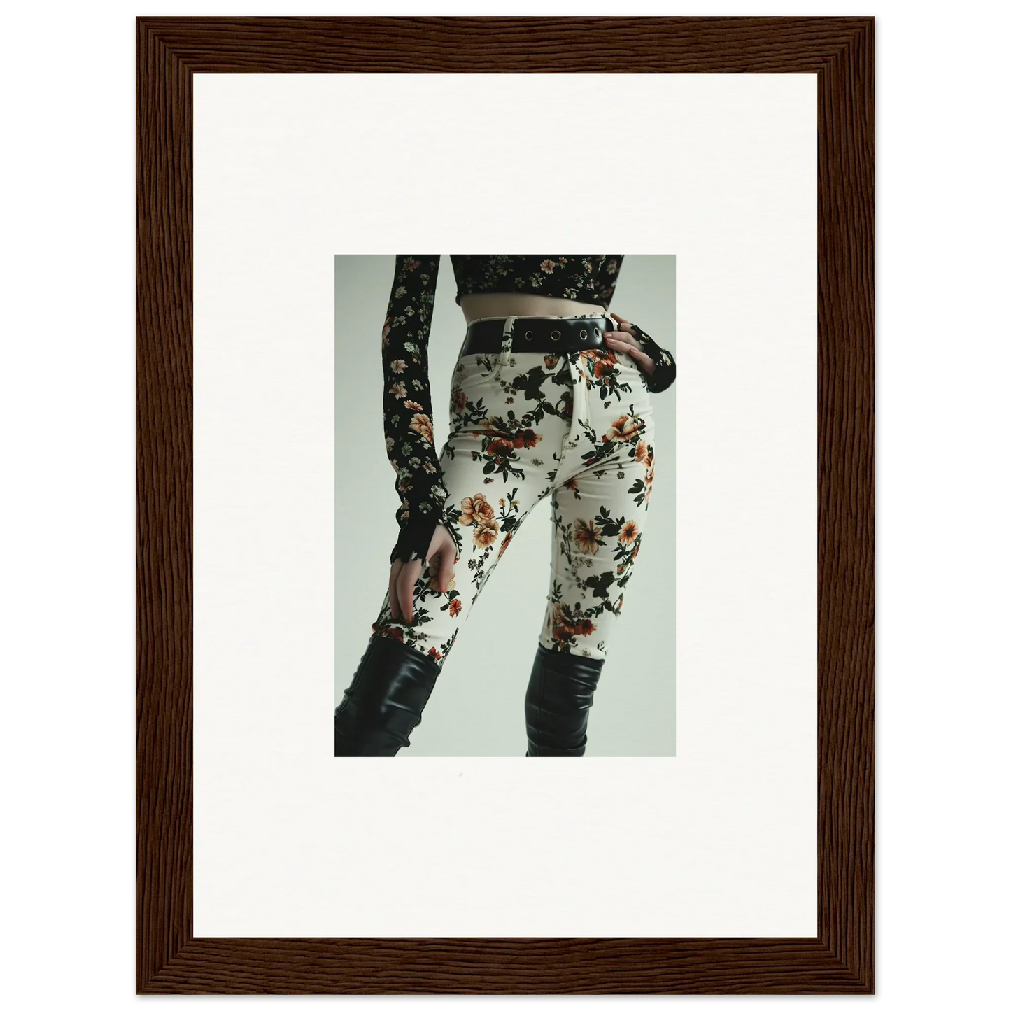 Floral-patterned pants or leggings with dark knee patches.