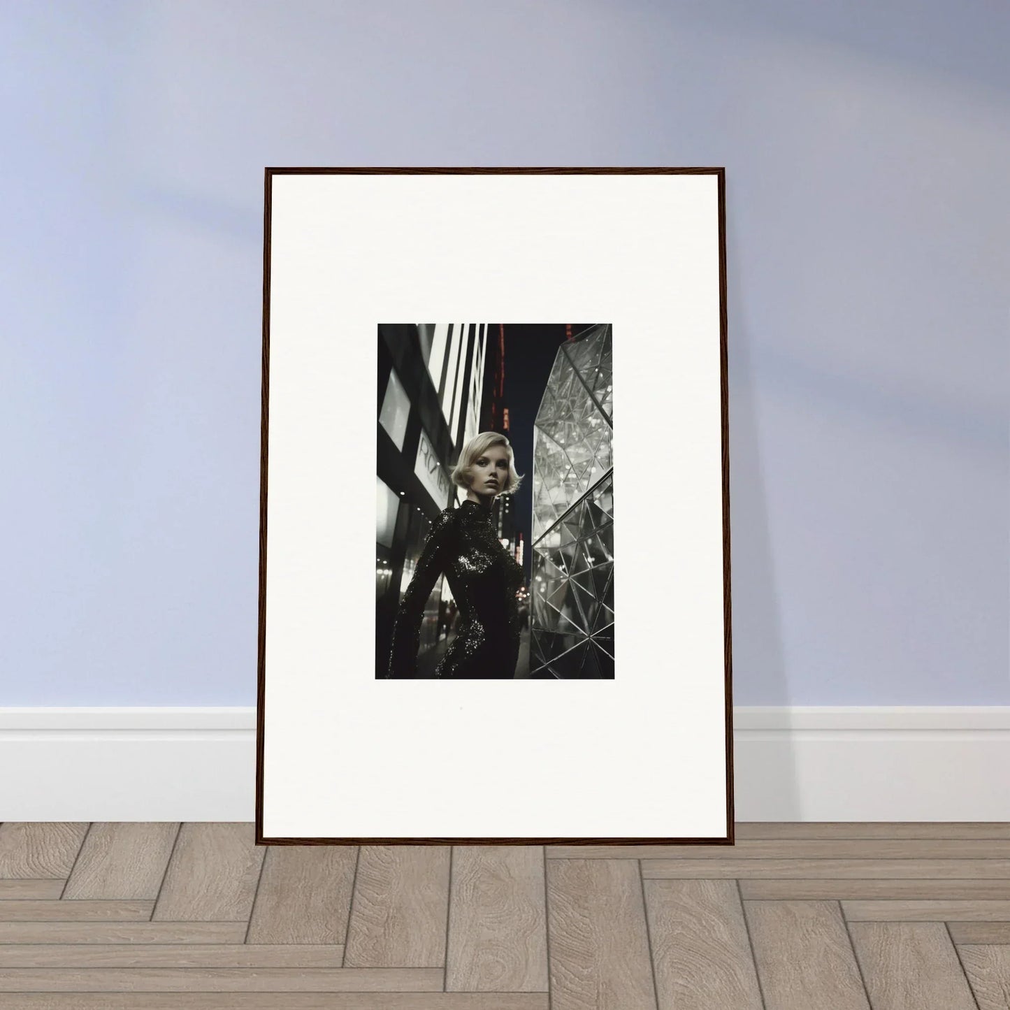 Framed black and white wall art of a person gazing through broken glass for unique room decor
