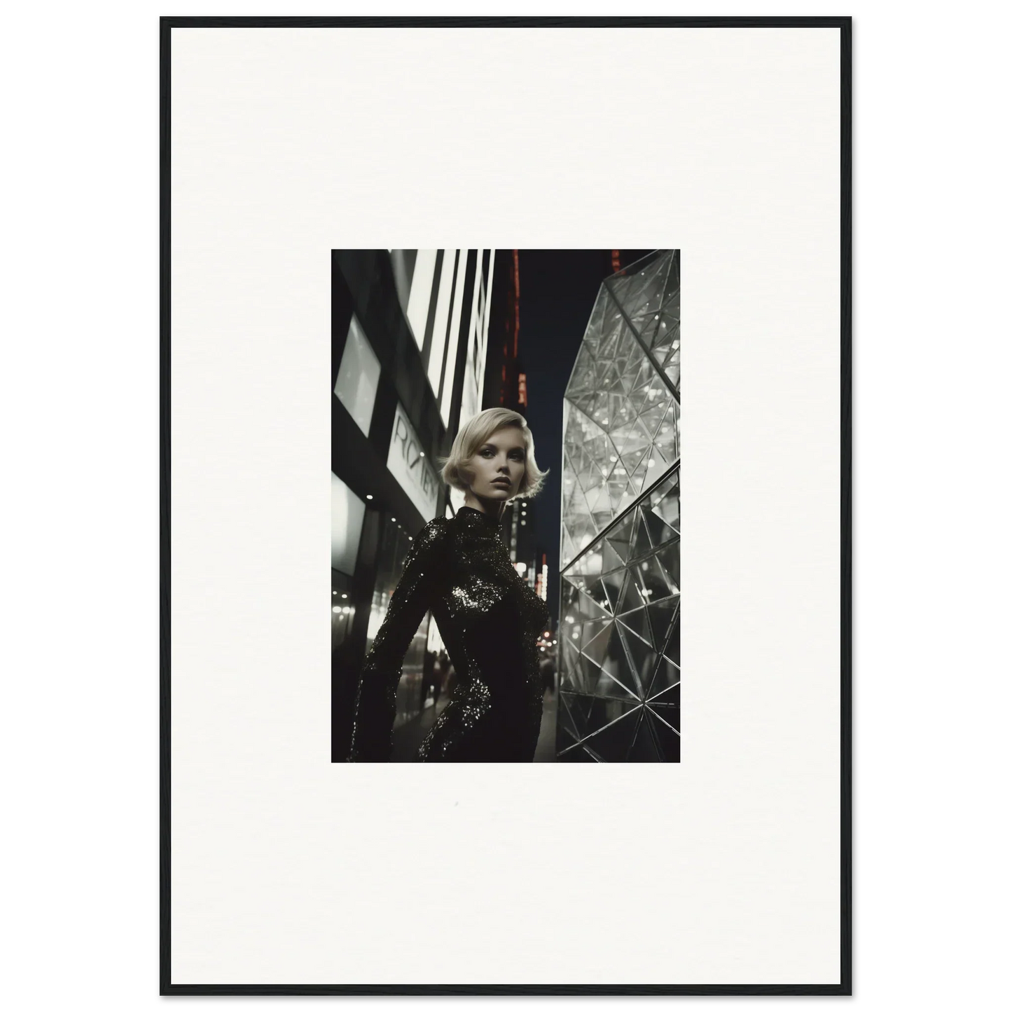 Black and white framed wall art of a woman in an urban setting for stylish room decor