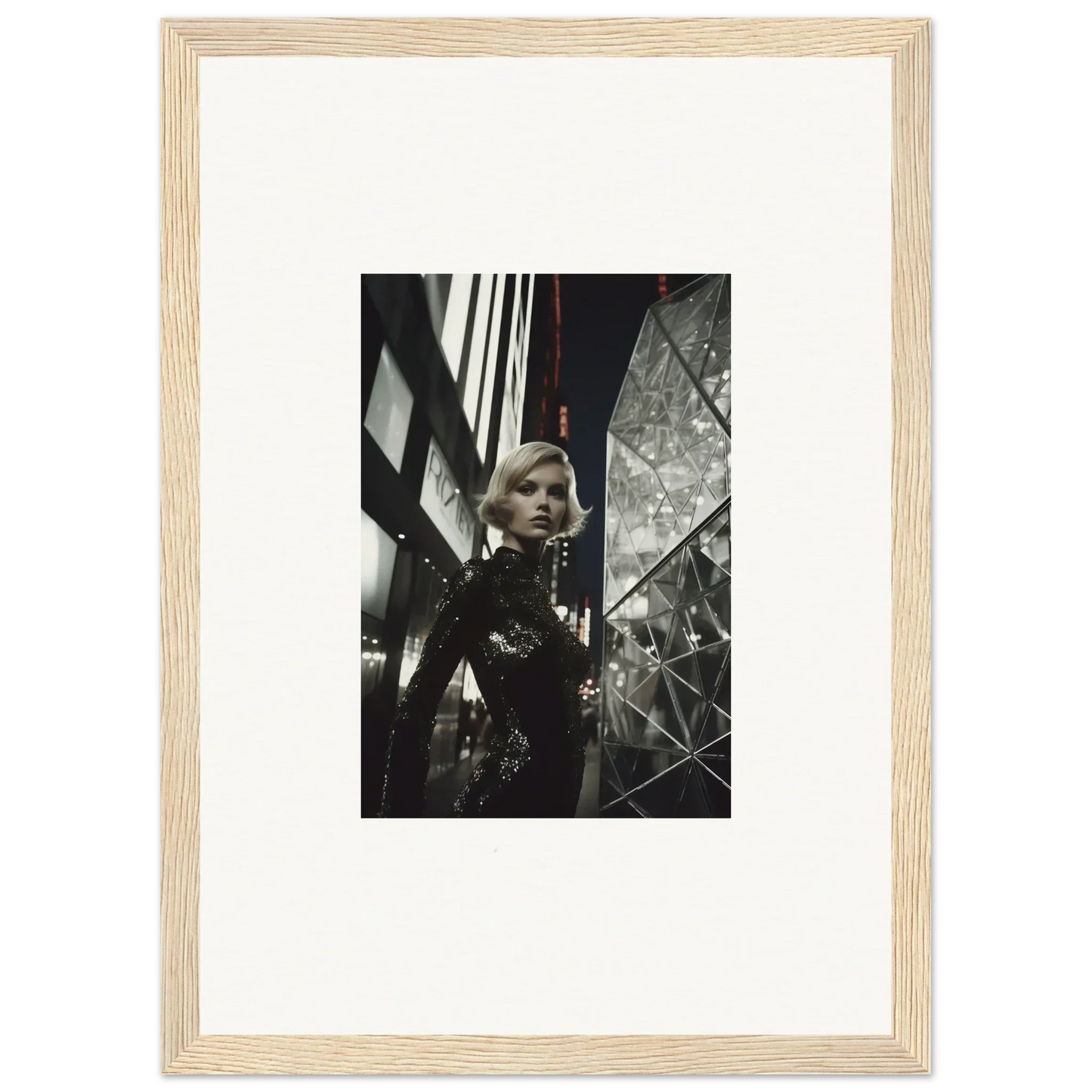 Framed black and white wall art of a woman in a sequined outfit for room decor